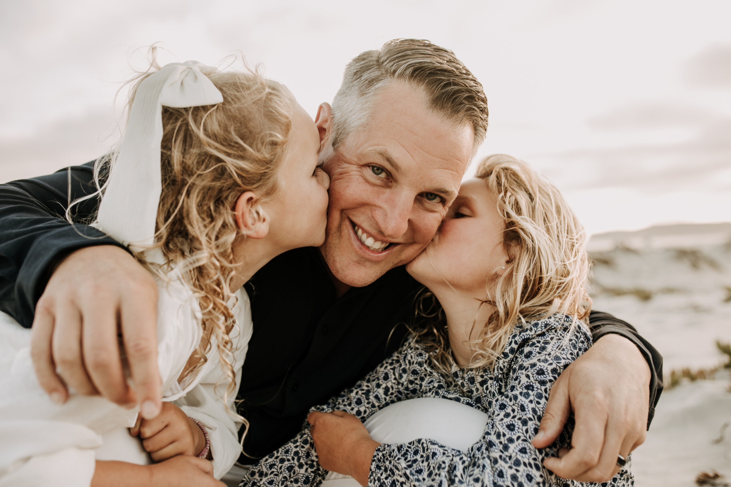 cool toned family photoshoot beach photos family photos on the beach cloudy vibes San Diego family photographer lifestyle photographer beach photoshoot inspo