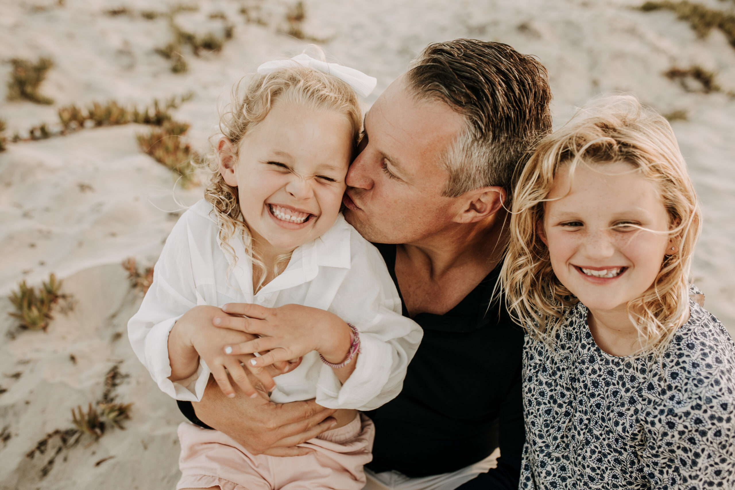 cool toned family photoshoot beach photos family photos on the beach cloudy vibes San Diego family photographer lifestyle photographer beach photoshoot inspo