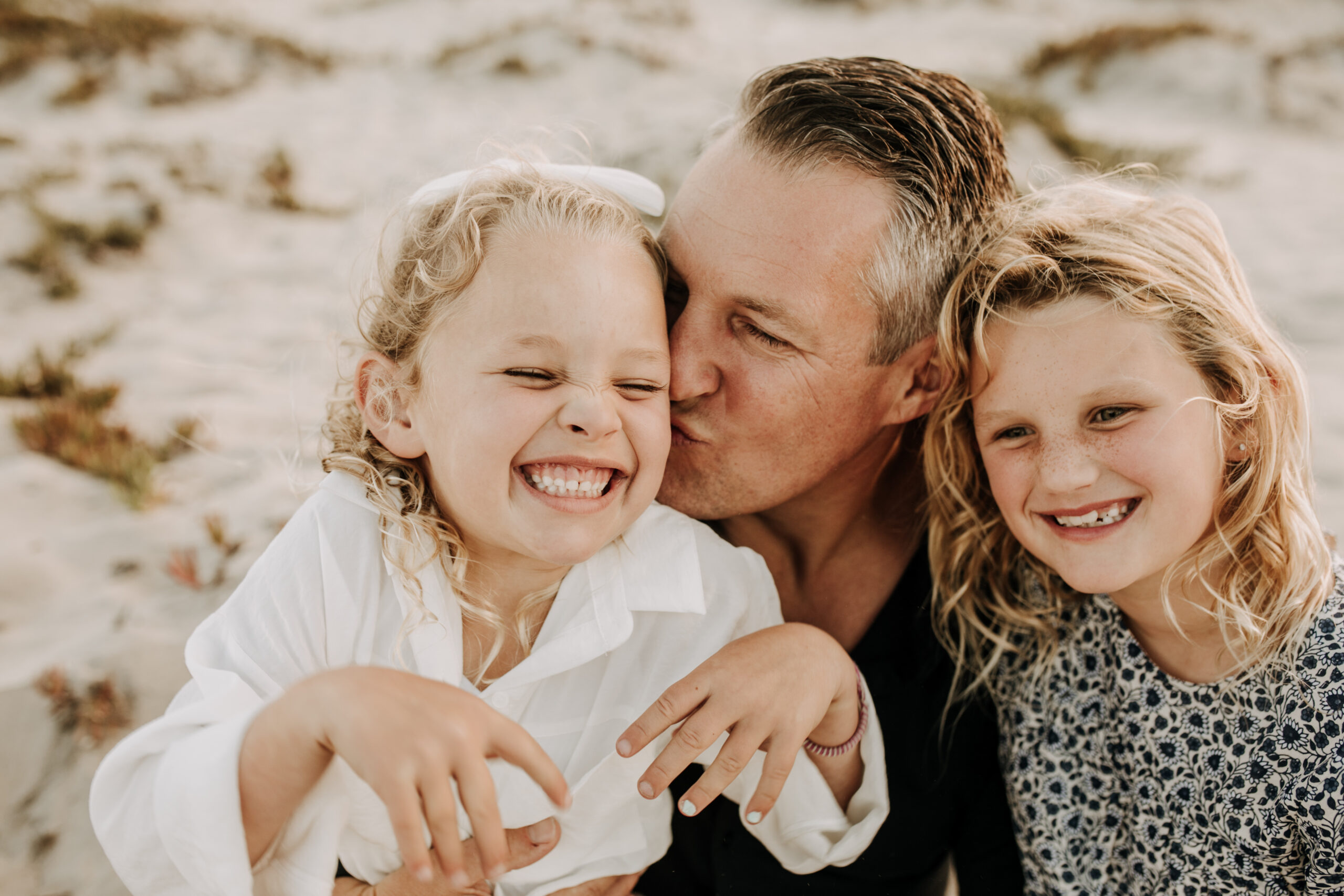 cool toned family photoshoot beach photos family photos on the beach cloudy vibes San Diego family photographer lifestyle photographer beach photoshoot inspo