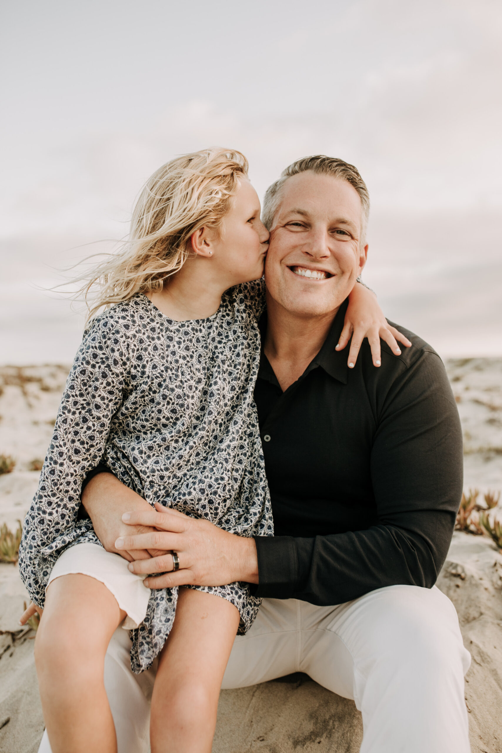 cool toned family photoshoot beach photos family photos on the beach cloudy vibes San Diego family photographer lifestyle photographer beach photoshoot inspo