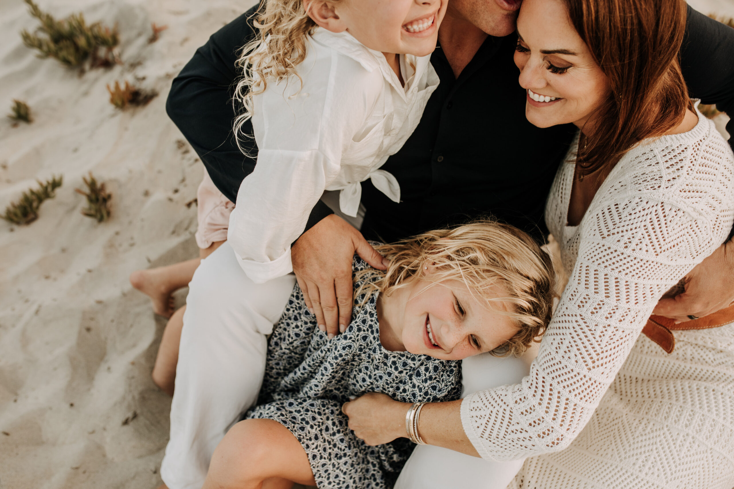 cool toned family photoshoot beach photos family photos on the beach cloudy vibes San Diego family photographer lifestyle photographer beach photoshoot inspo