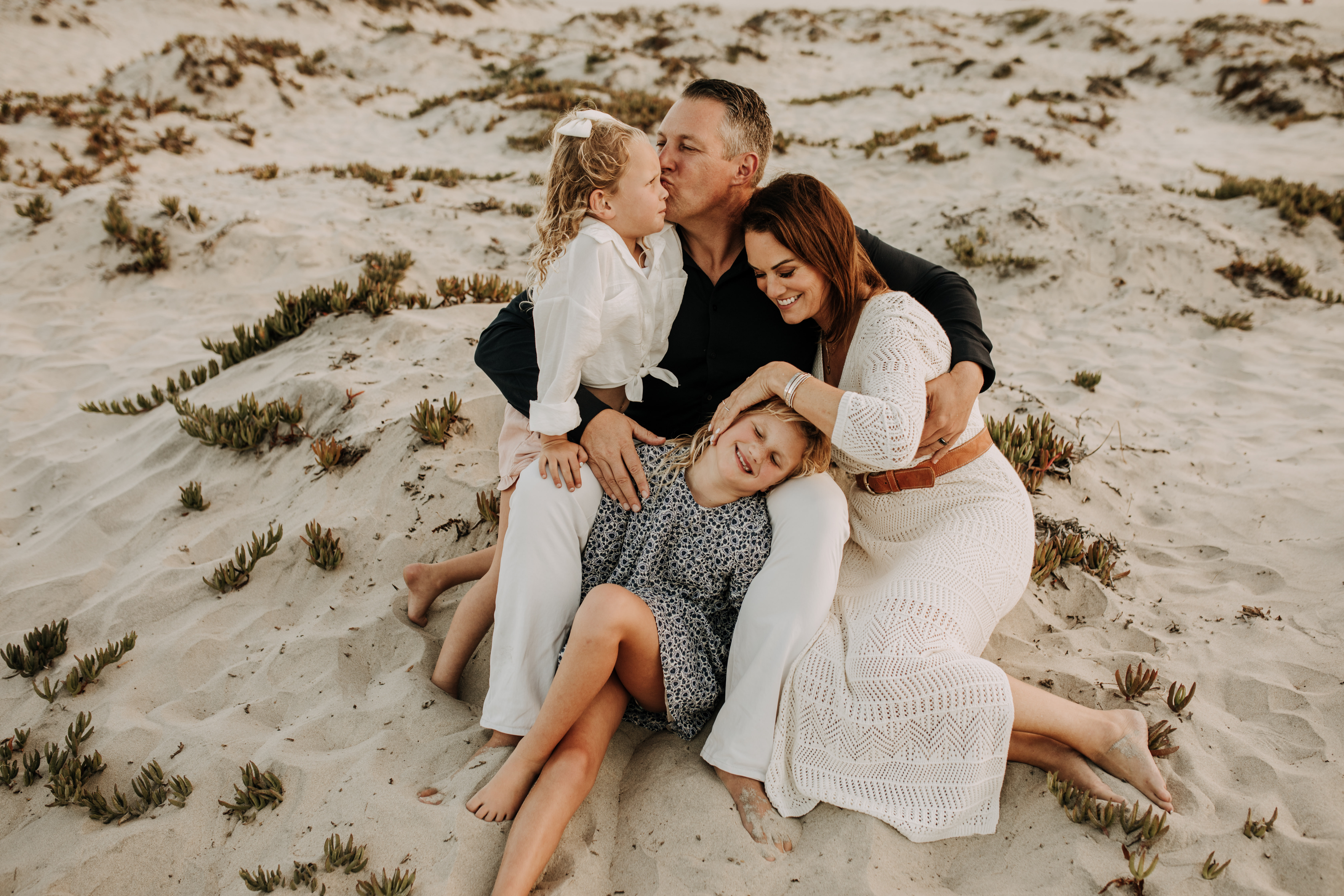 cool toned family photoshoot beach photos family photos on the beach cloudy vibes San Diego family photographer lifestyle photographer beach photoshoot inspo