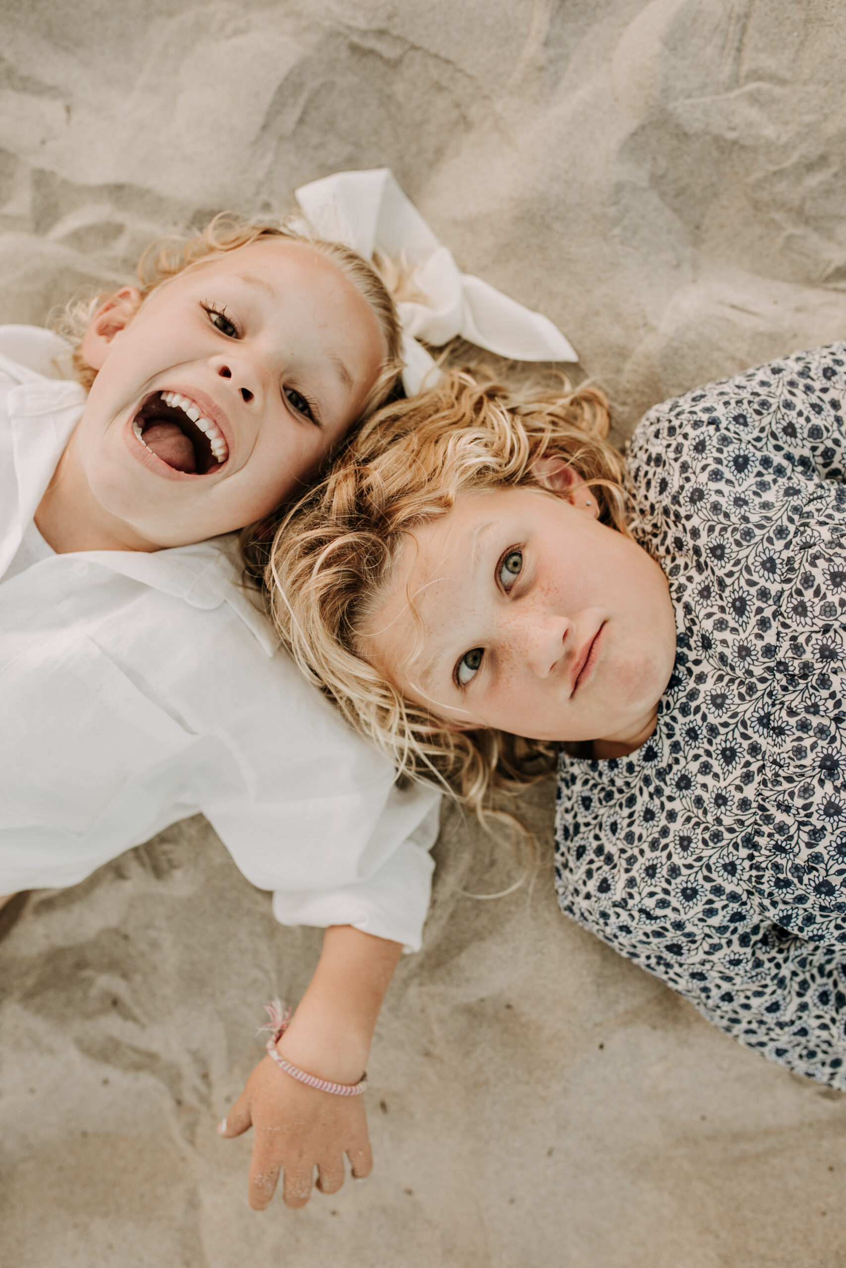 cool toned family photoshoot beach photos family photos on the beach cloudy vibes San Diego family photographer lifestyle photographer beach photoshoot inspo