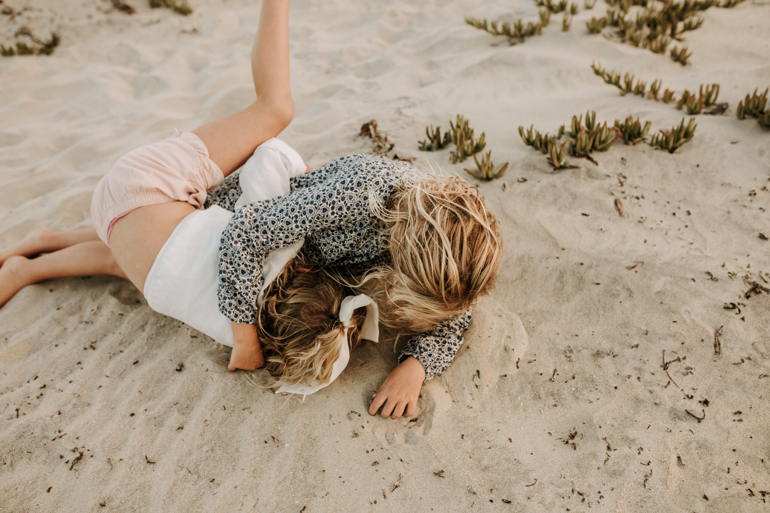 cool toned family photoshoot beach photos family photos on the beach cloudy vibes San Diego family photographer lifestyle photographer beach photoshoot inspo