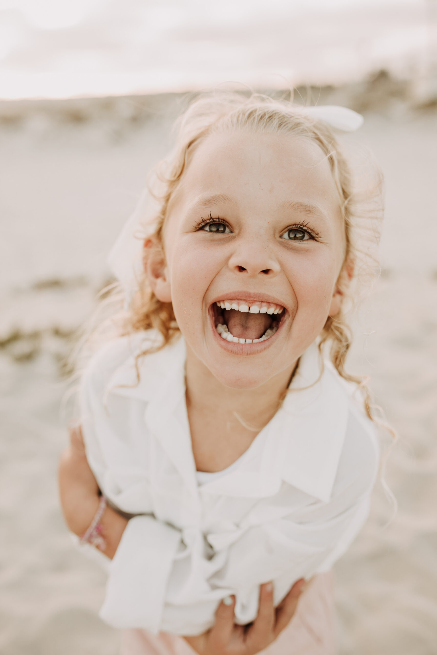 cool toned family photoshoot beach photos family photos on the beach cloudy vibes San Diego family photographer lifestyle photographer beach photoshoot inspo