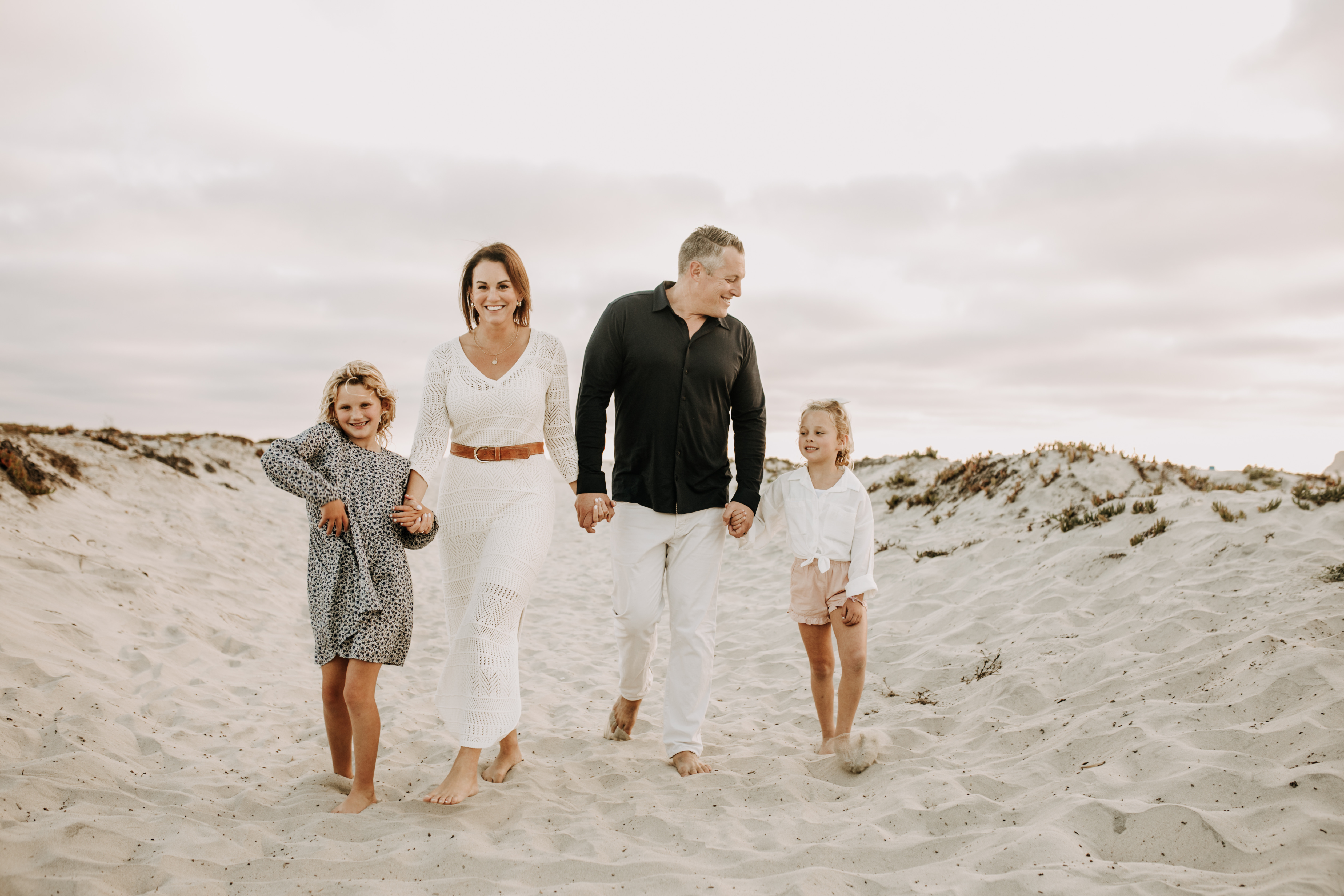 cool toned family photoshoot beach photos family photos on the beach cloudy vibes San Diego family photographer lifestyle photographer beach photoshoot inspo