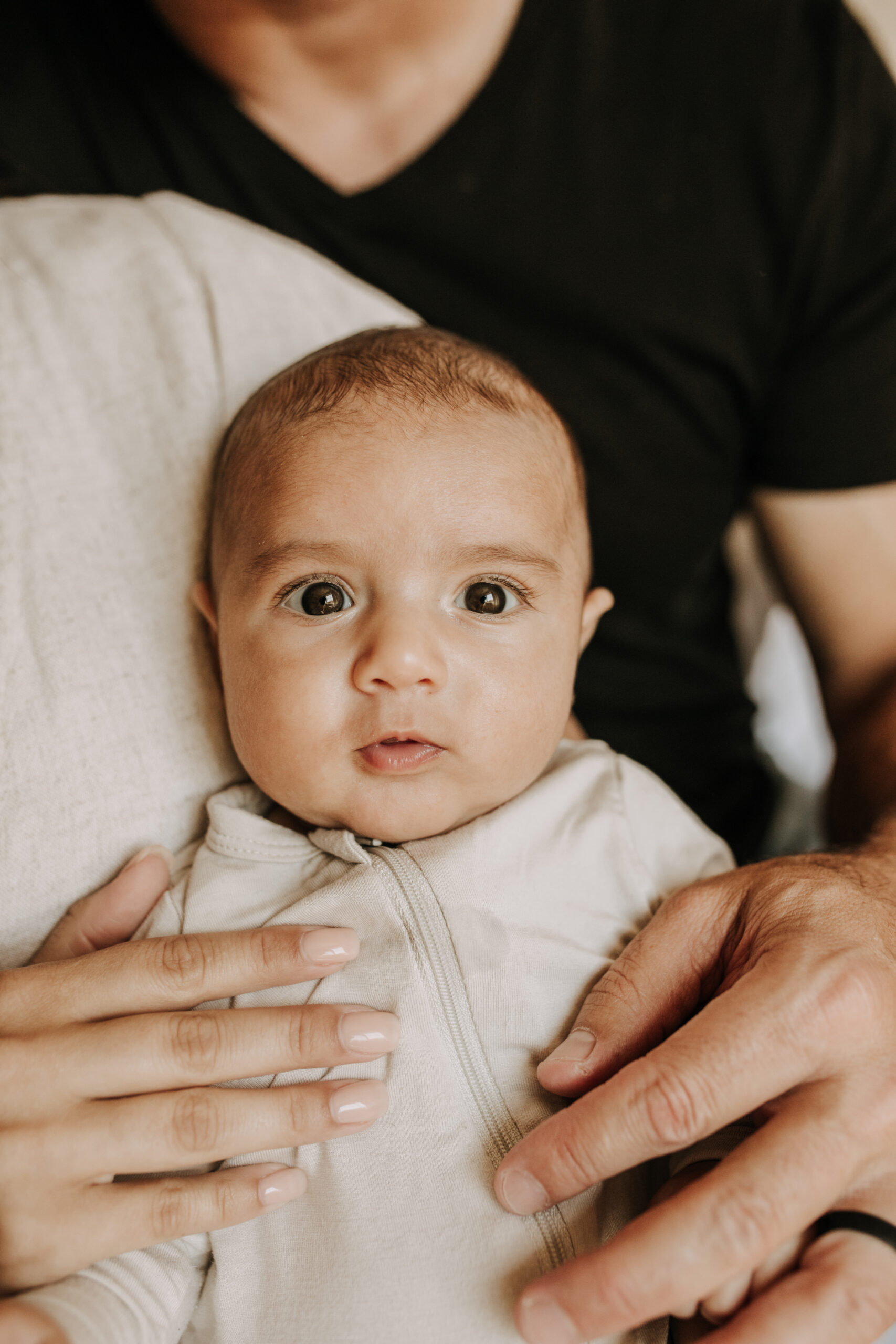 warm toned tan beige in home newborn baby photos family photos newborn baby new mom and dad San Diego family photographer Sabrina kinsella sabrinalynnphoto