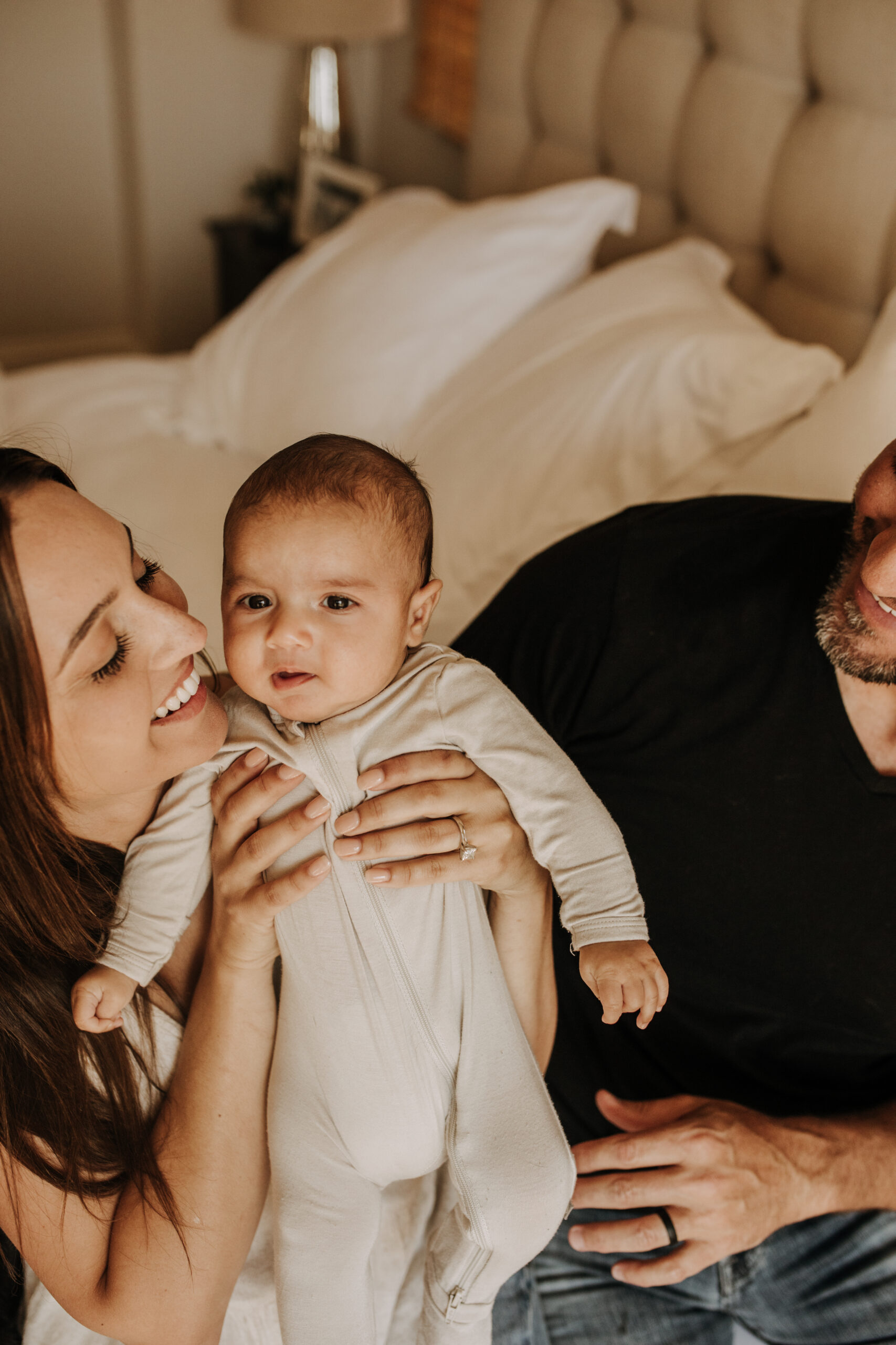 warm toned tan beige in home newborn baby photos family photos newborn baby new mom and dad San Diego family photographer Sabrina kinsella sabrinalynnphoto