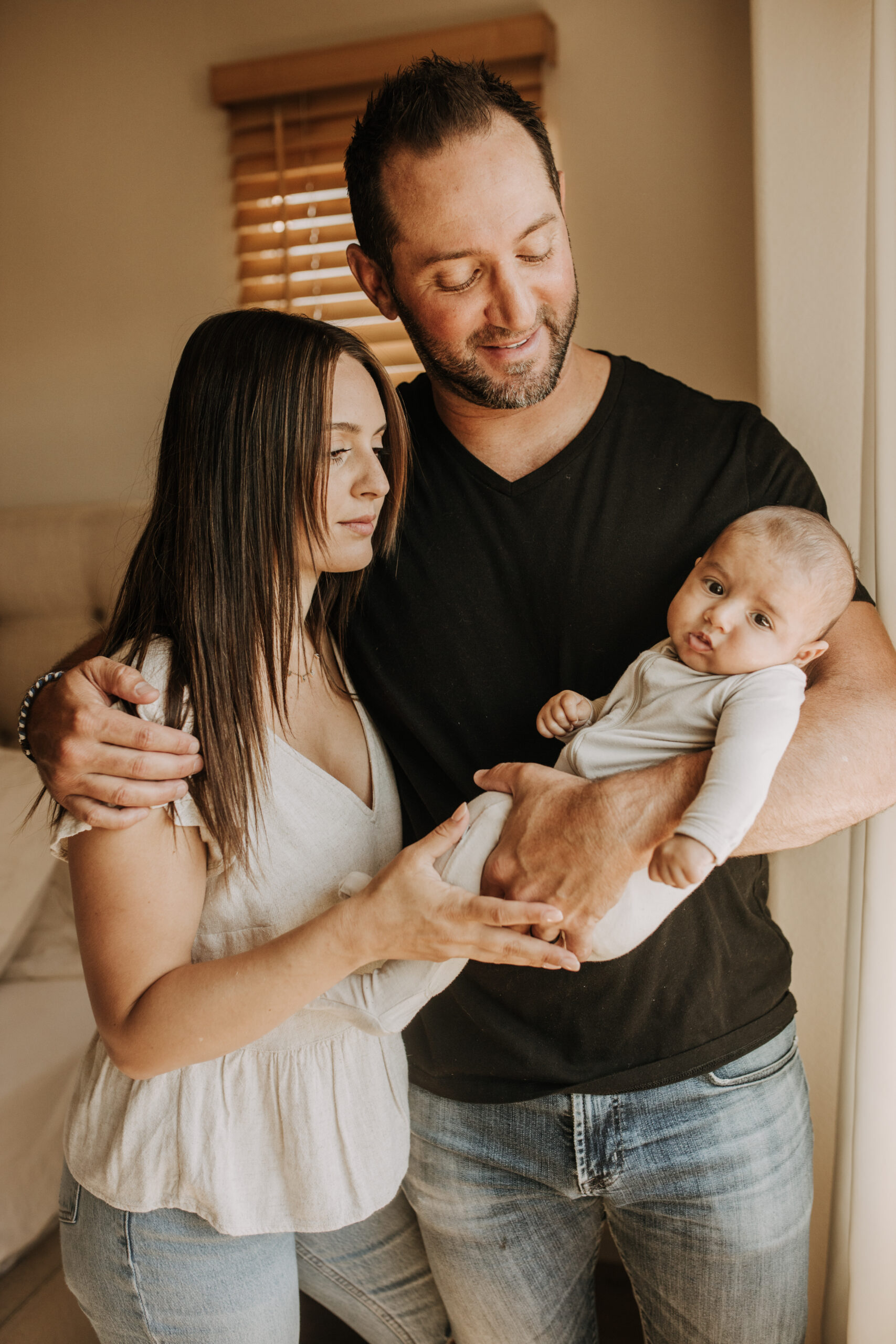 warm toned tan beige in home newborn baby photos family photos newborn baby new mom and dad San Diego family photographer Sabrina kinsella sabrinalynnphoto