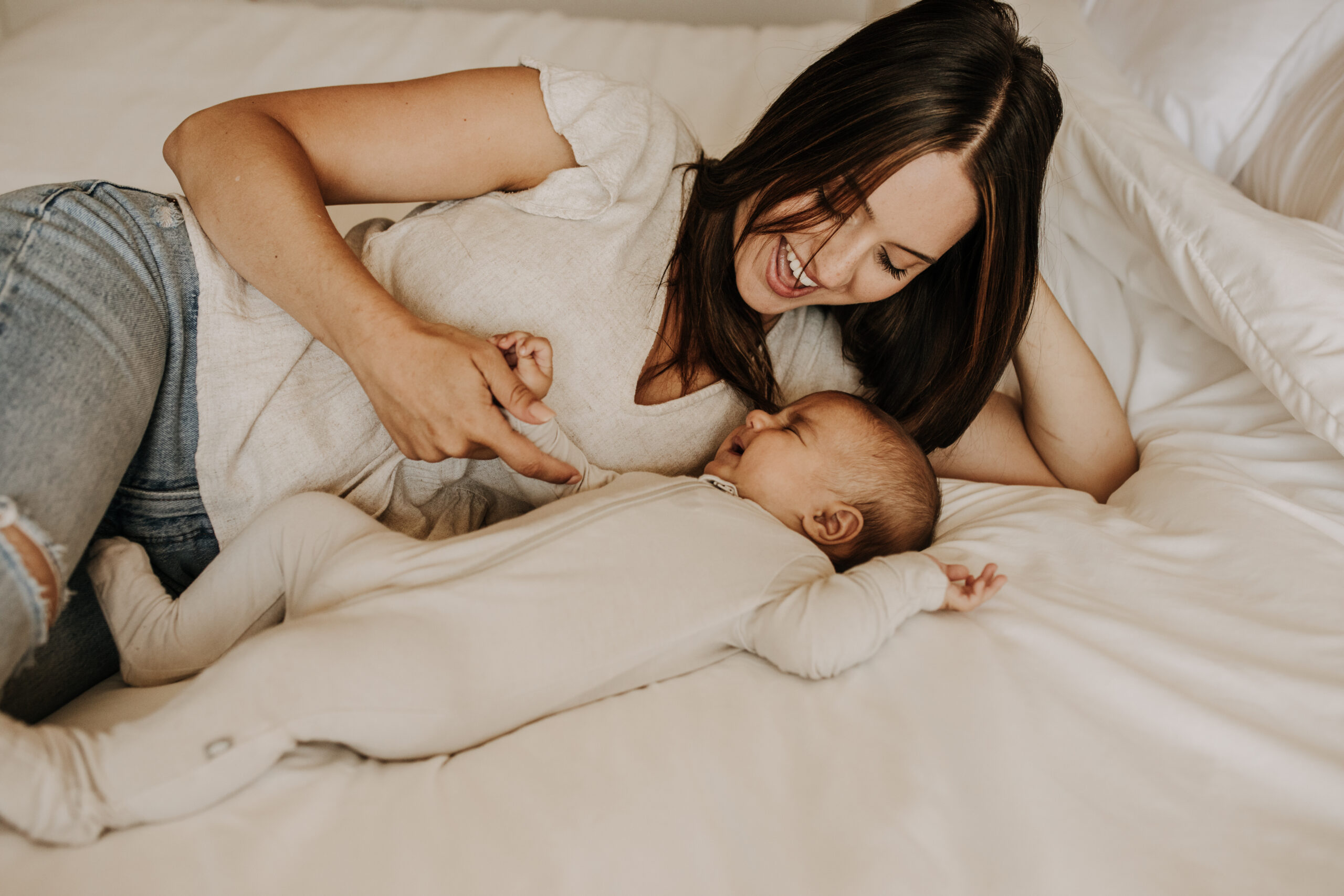 warm toned tan beige in home newborn baby photos family photos newborn baby new mom and dad San Diego family photographer Sabrina kinsella sabrinalynnphoto