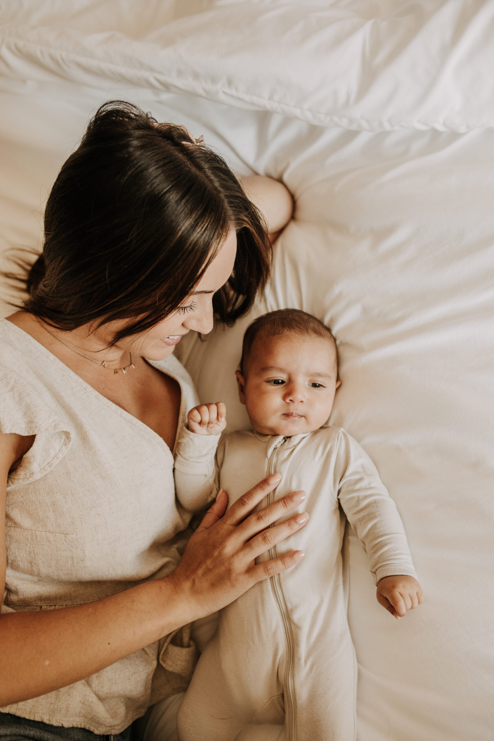 warm toned tan beige in home newborn baby photos family photos newborn baby new mom and dad San Diego family photographer Sabrina kinsella sabrinalynnphoto