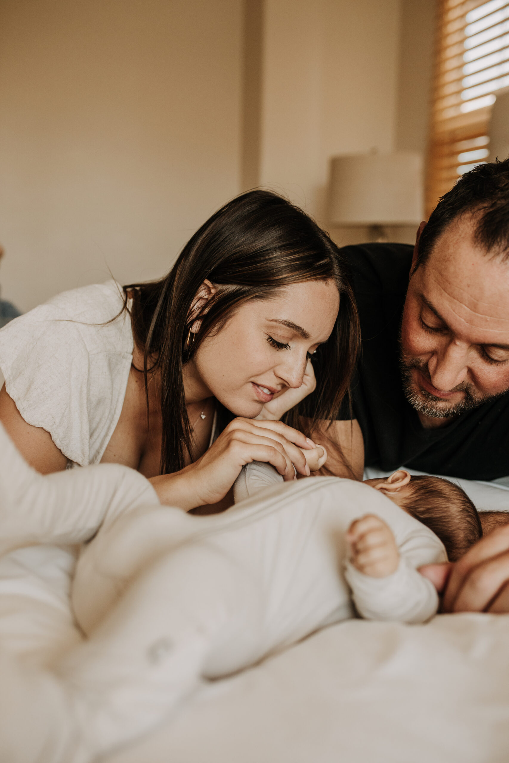 warm toned tan beige in home newborn baby photos family photos newborn baby new mom and dad San Diego family photographer Sabrina kinsella sabrinalynnphoto