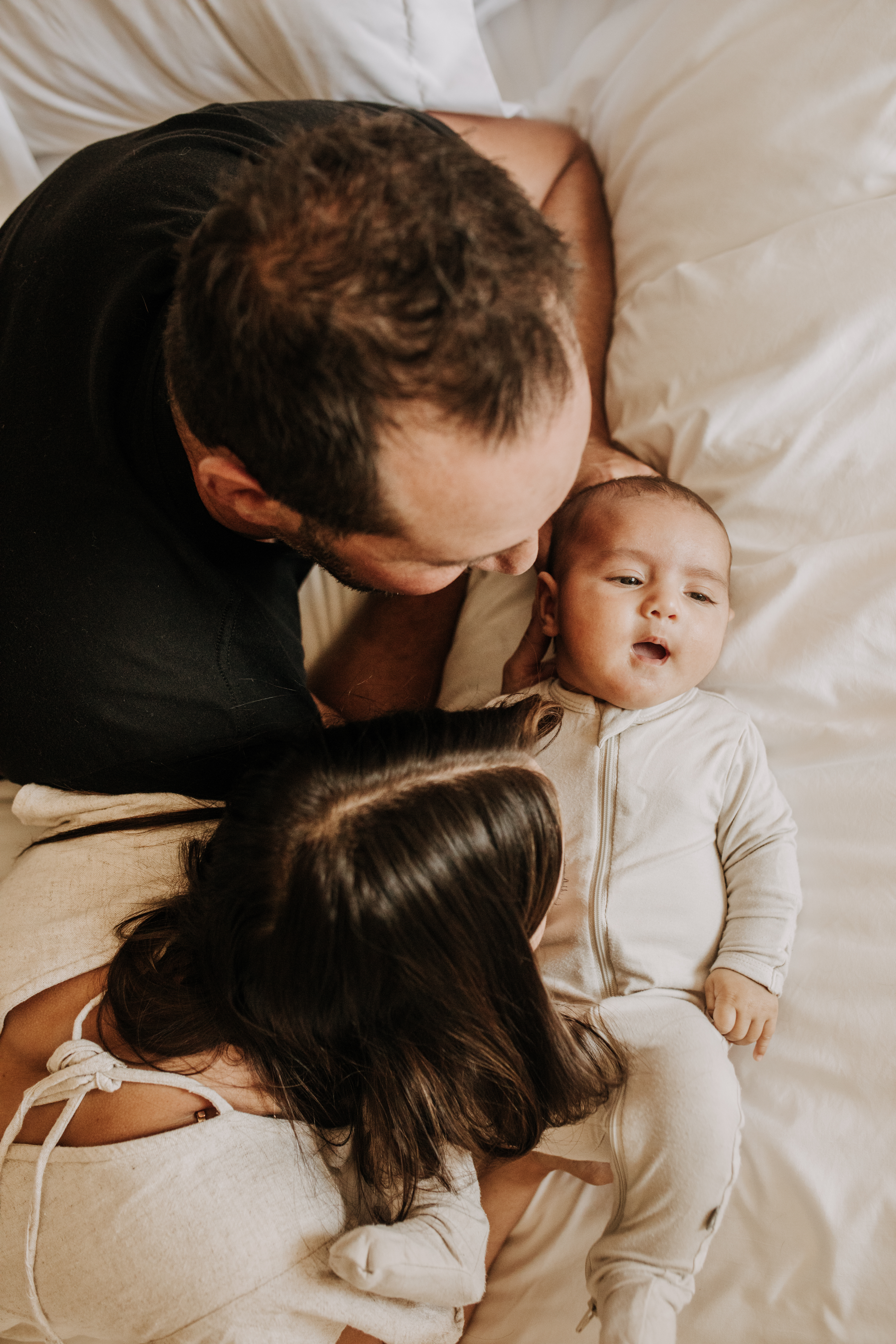 warm toned tan beige in home newborn baby photos family photos newborn baby new mom and dad San Diego family photographer Sabrina kinsella sabrinalynnphoto