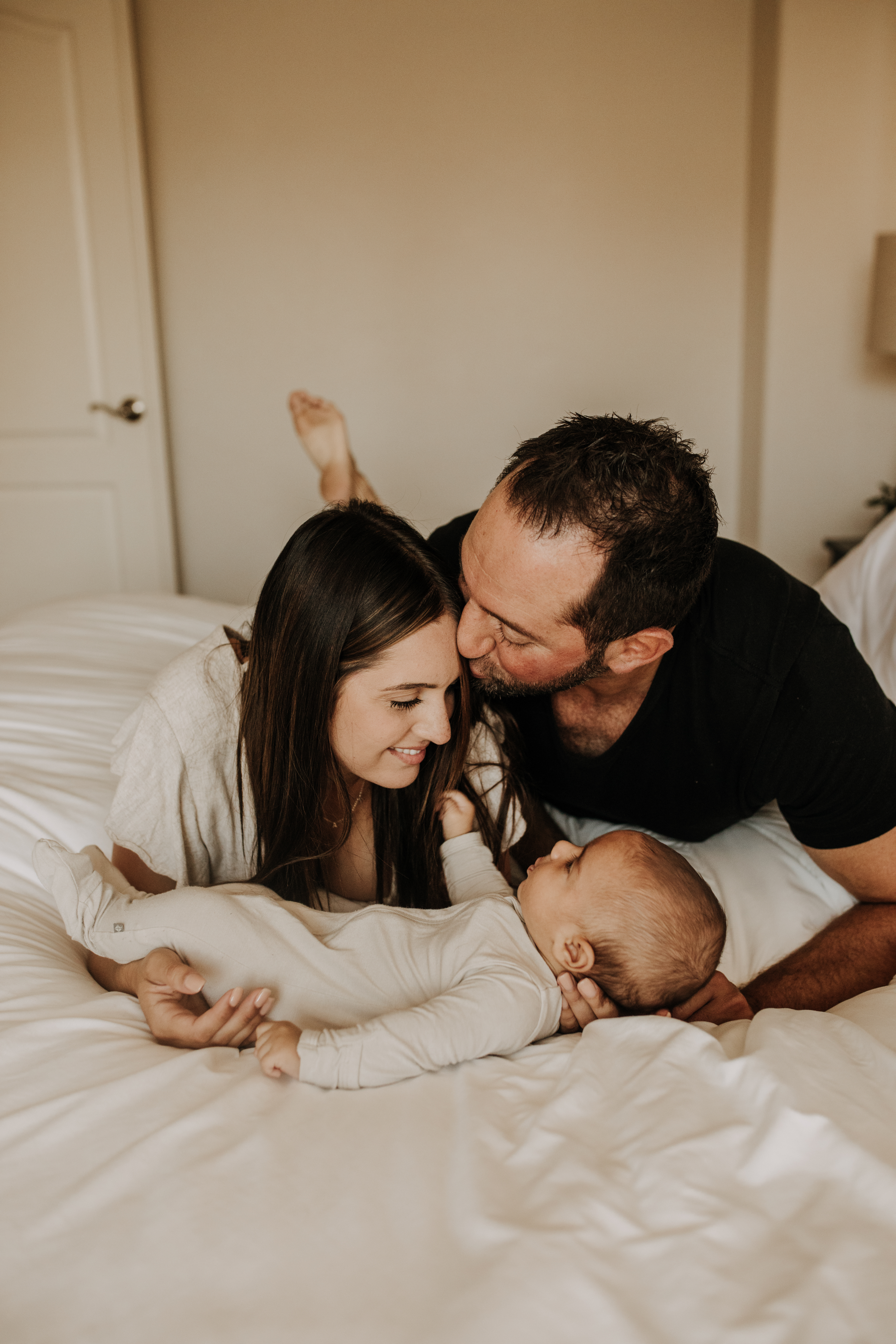 warm toned tan beige in home newborn baby photos family photos newborn baby new mom and dad San Diego family photographer Sabrina kinsella sabrinalynnphoto