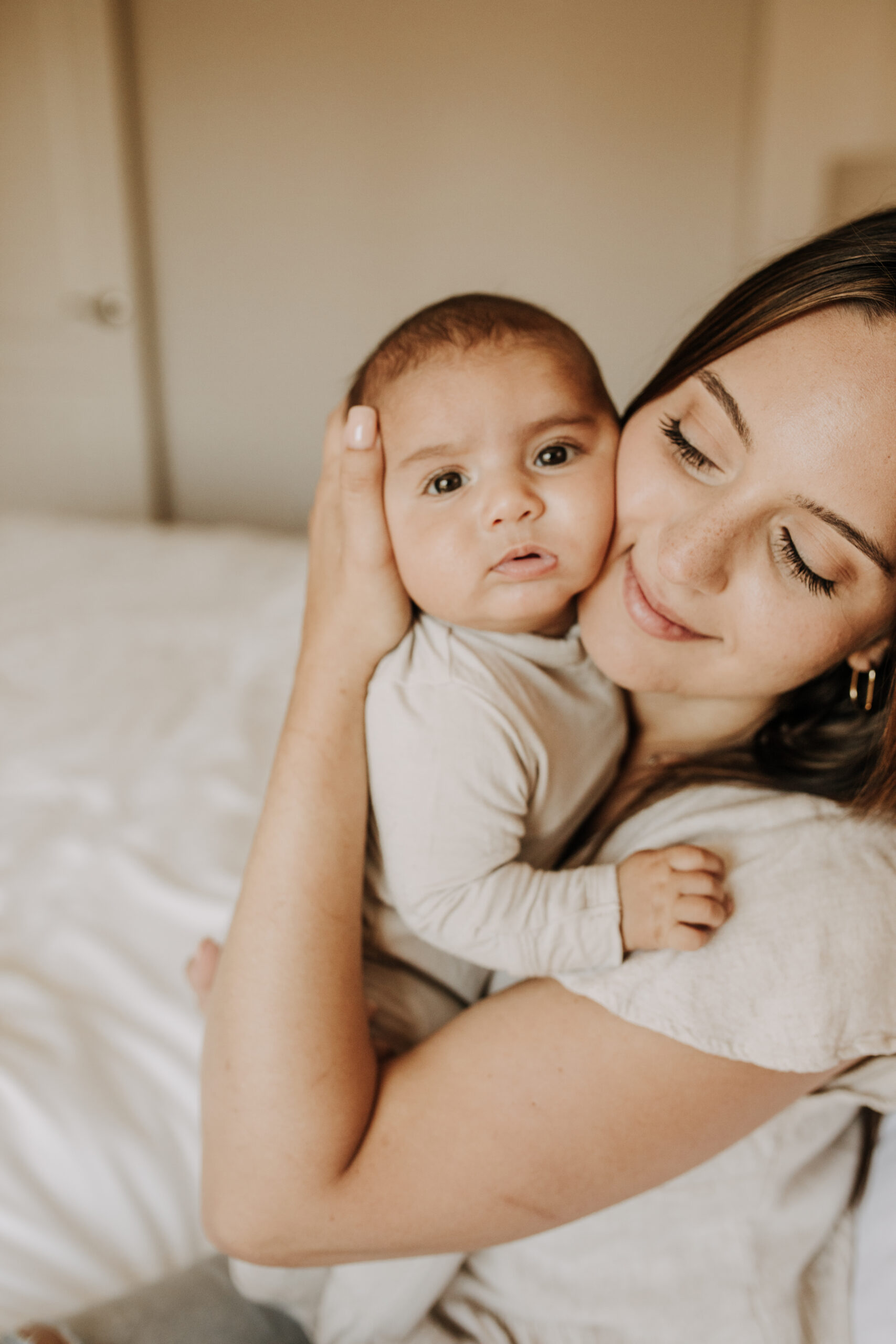 warm toned tan beige in home newborn baby photos family photos newborn baby new mom and dad San Diego family photographer Sabrina kinsella sabrinalynnphoto