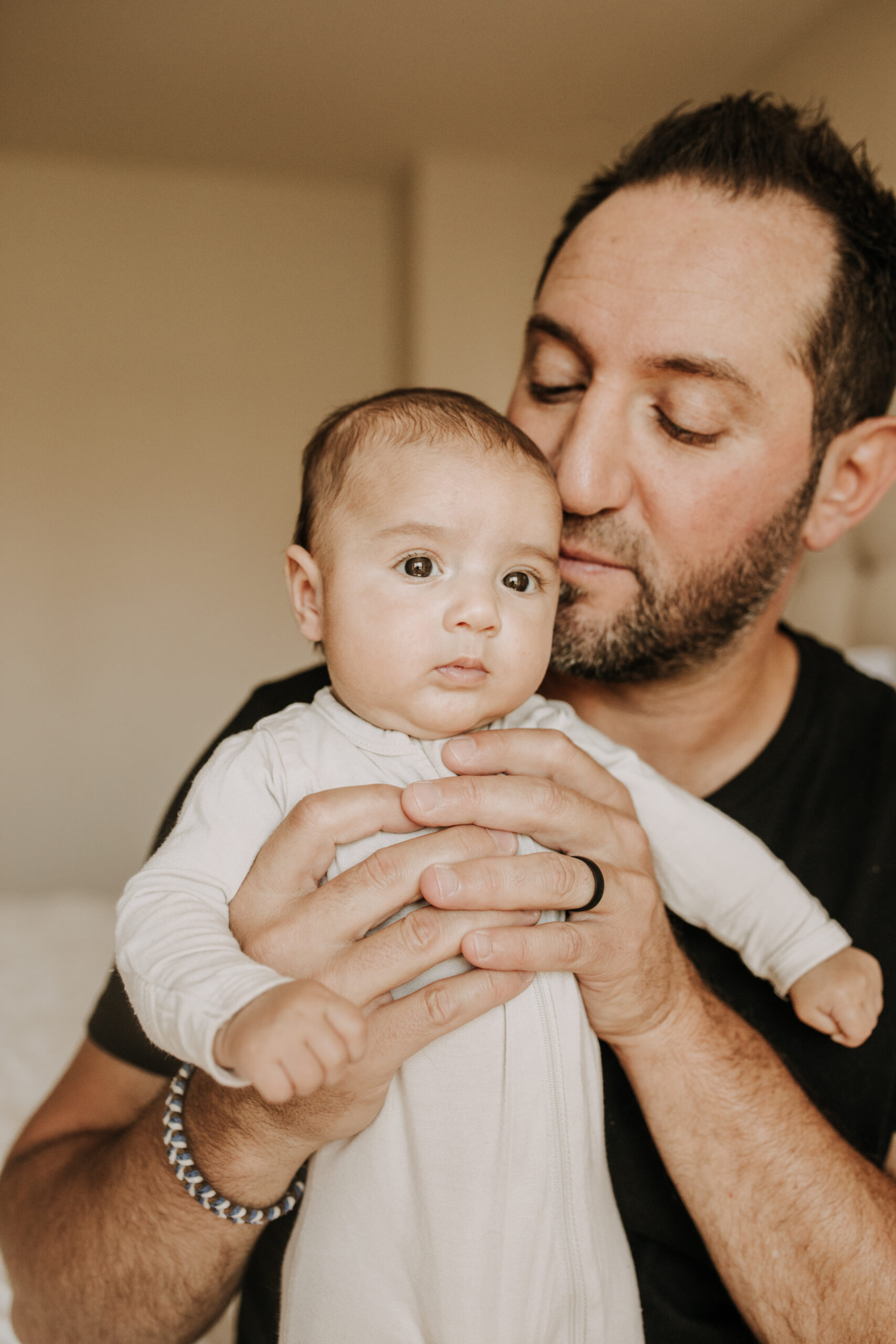 warm toned tan beige in home newborn baby photos family photos newborn baby new mom and dad San Diego family photographer Sabrina kinsella sabrinalynnphoto