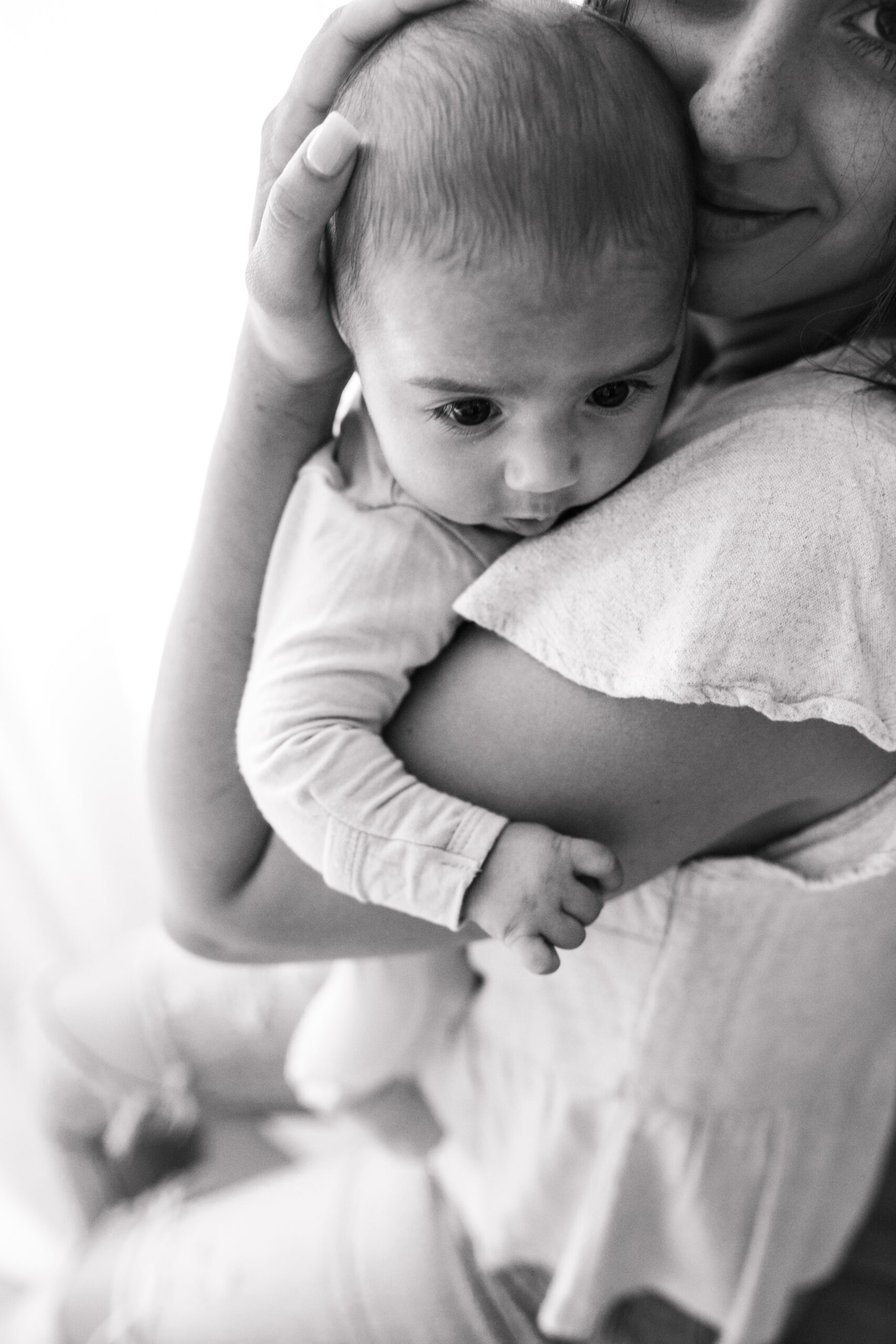 warm toned tan beige in home newborn baby photos family photos newborn baby new mom and dad San Diego family photographer Sabrina kinsella sabrinalynnphoto