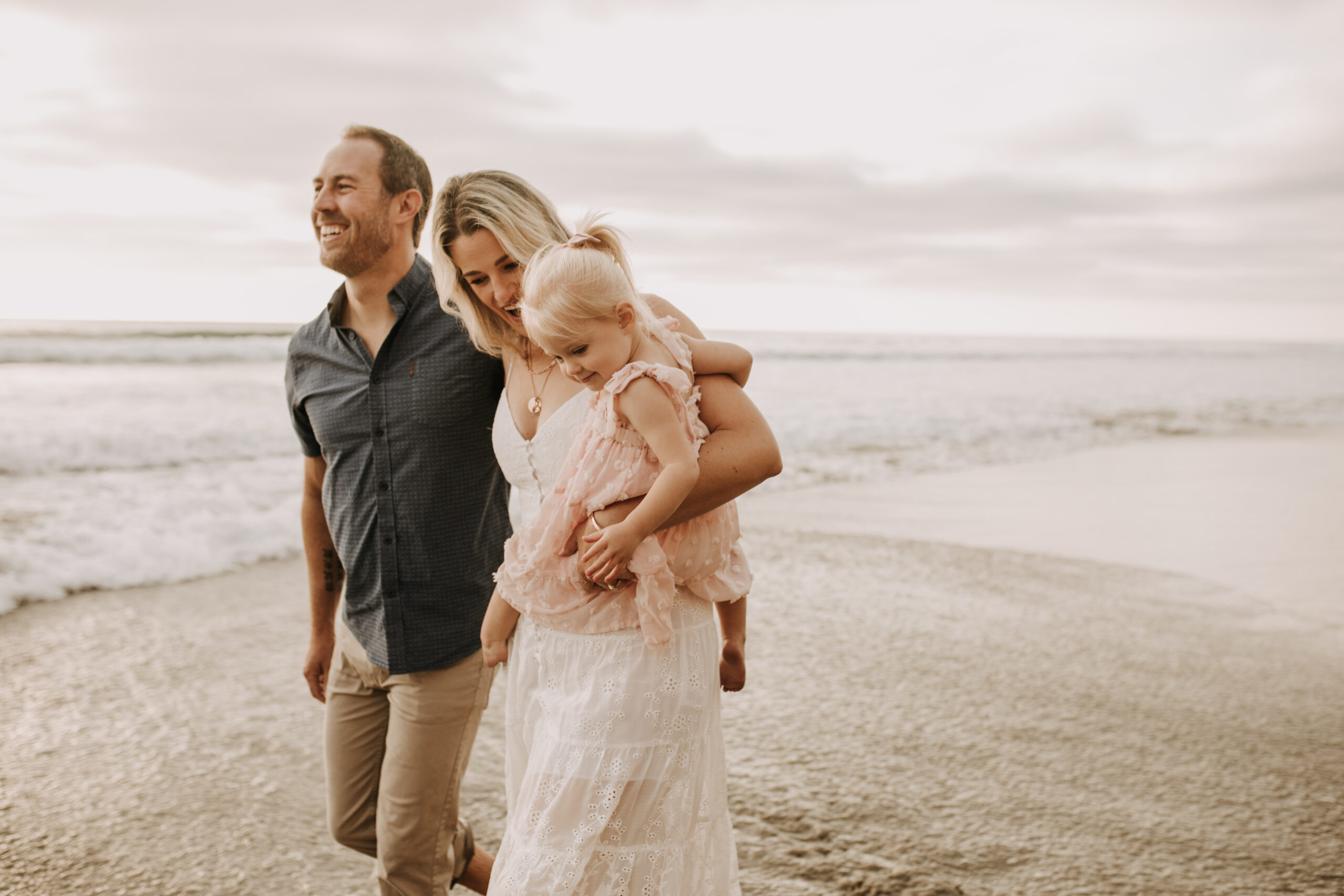 family photos on the beach sunset beach family dad mom baby water golden hour San Diego beach family photos San Diego family photographer