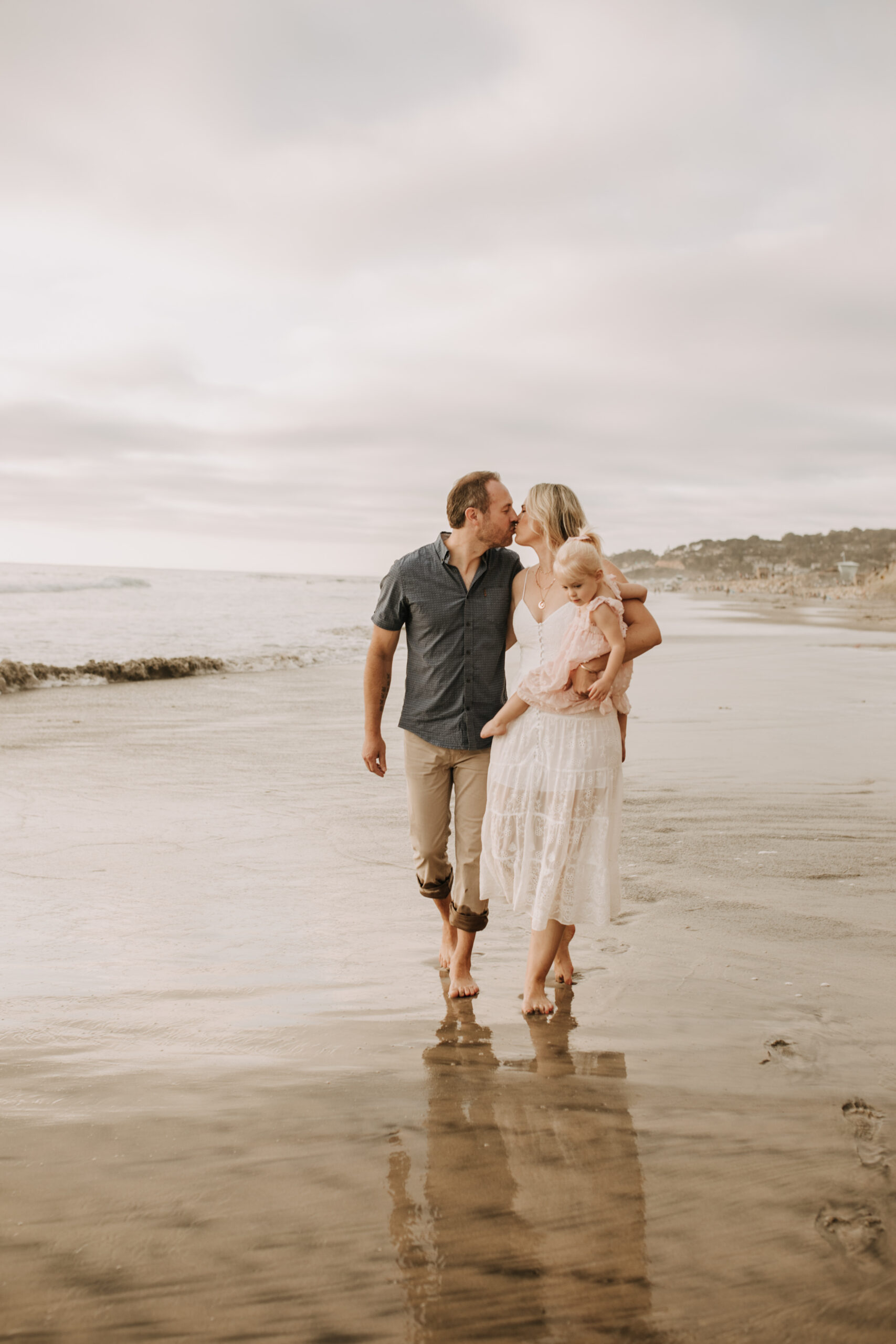 family photos on the beach sunset beach family dad mom baby water golden hour San Diego beach family photos San Diego family photographer