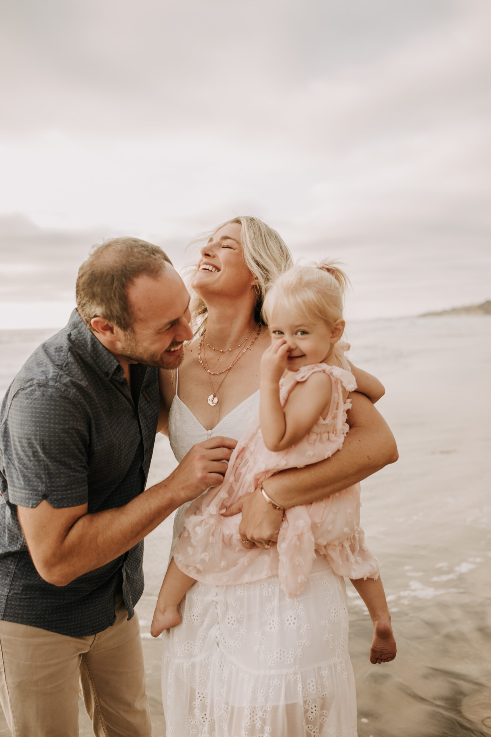 family photos on the beach sunset beach family dad mom baby water golden hour San Diego beach family photos San Diego family photographer