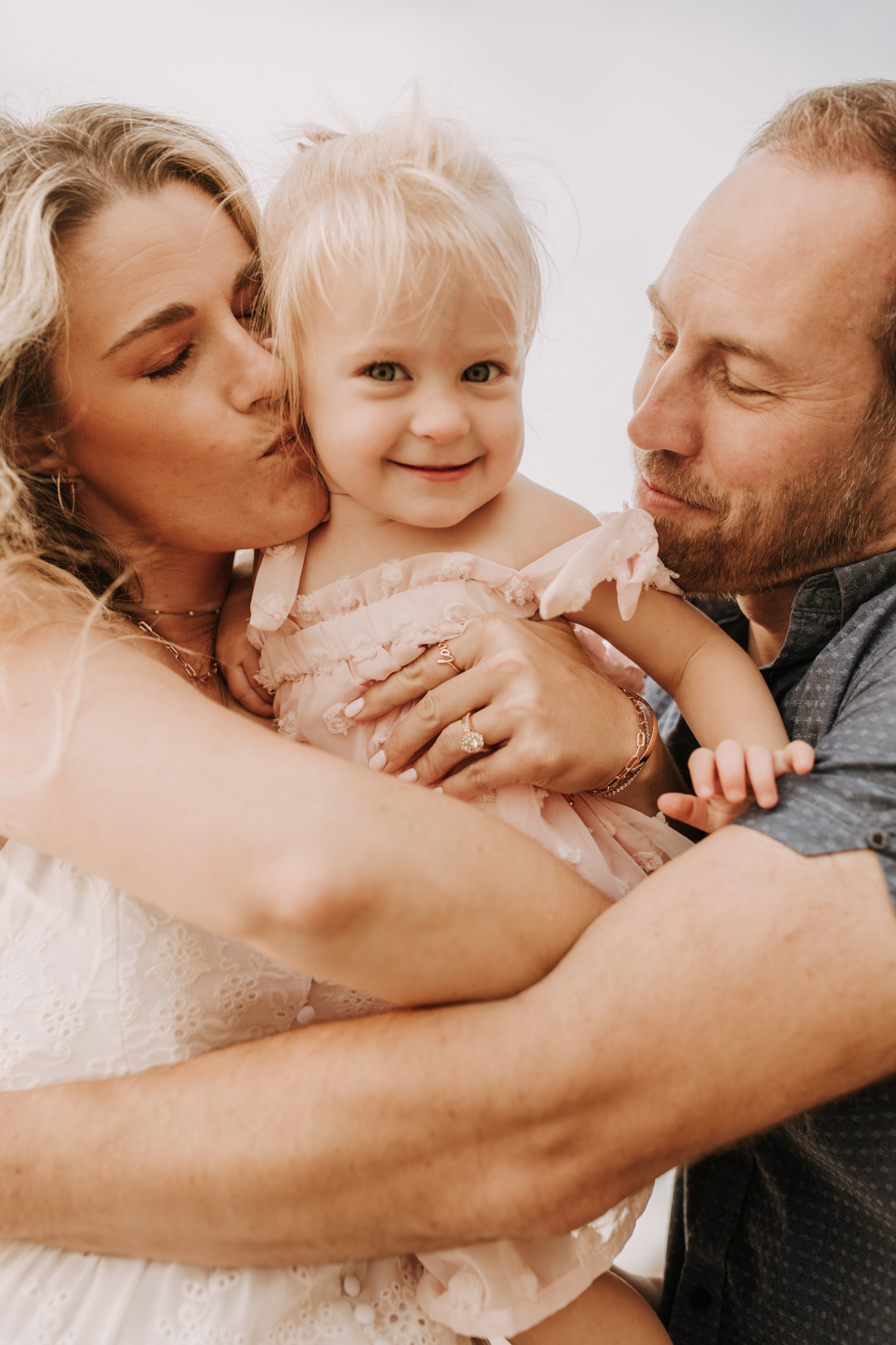 family photos on the beach sunset beach family dad mom baby water golden hour San Diego beach family photos San Diego family photographer