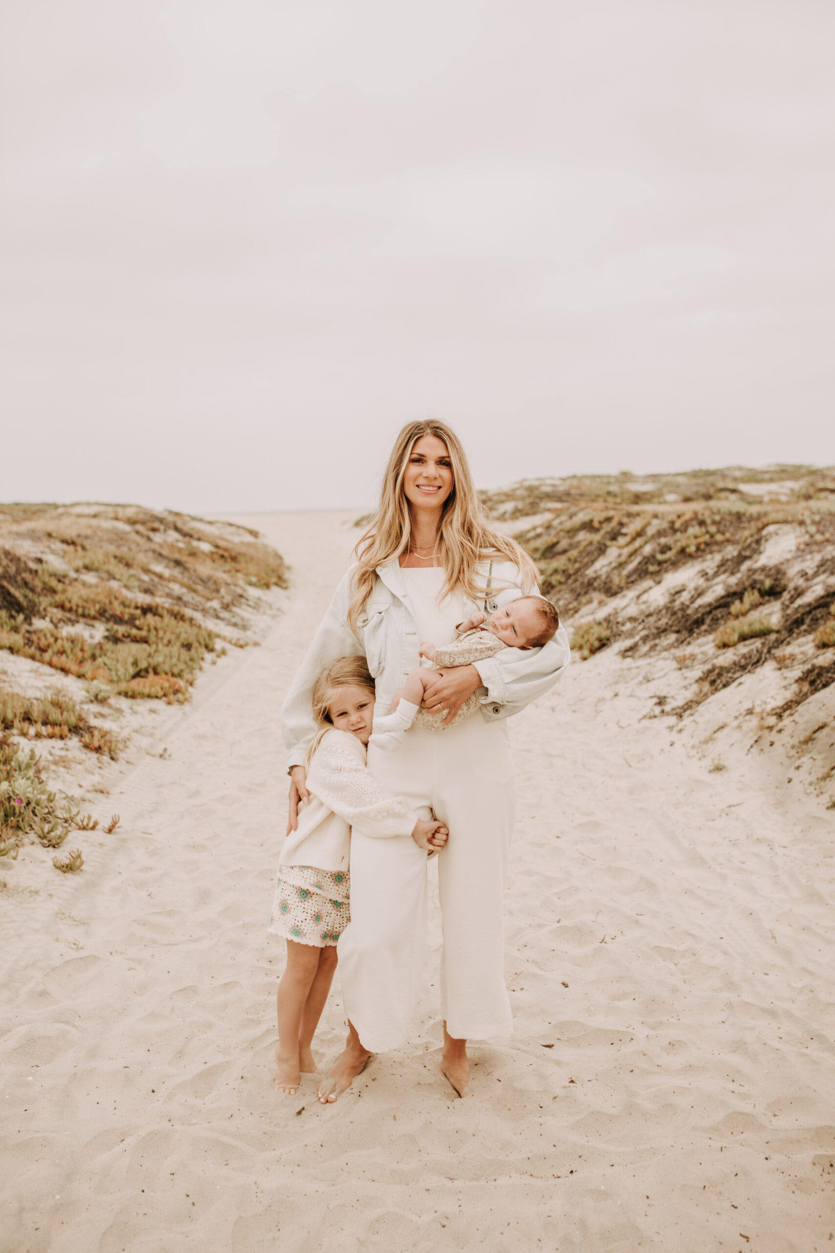 warm toned neutral color outdoor family photos beach day family photos newborn photos infant family cloudy day san digo family photographer Sabrina Kinsella