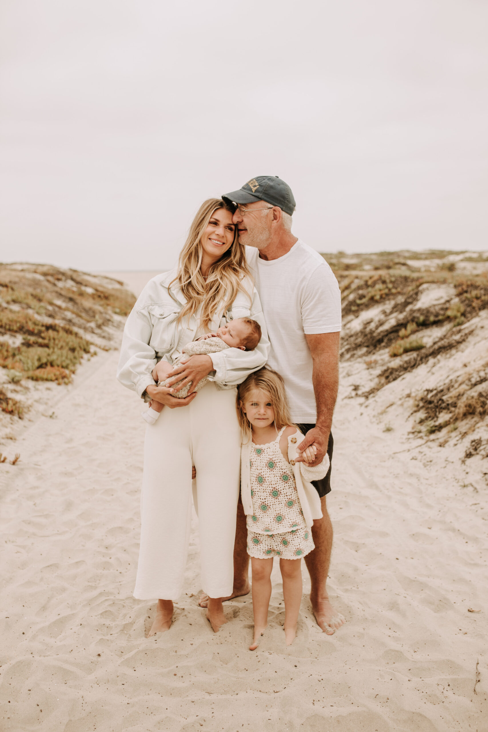 warm toned neutral color outdoor family photos beach day family photos newborn photos infant family cloudy day san digo family photographer Sabrina Kinsella