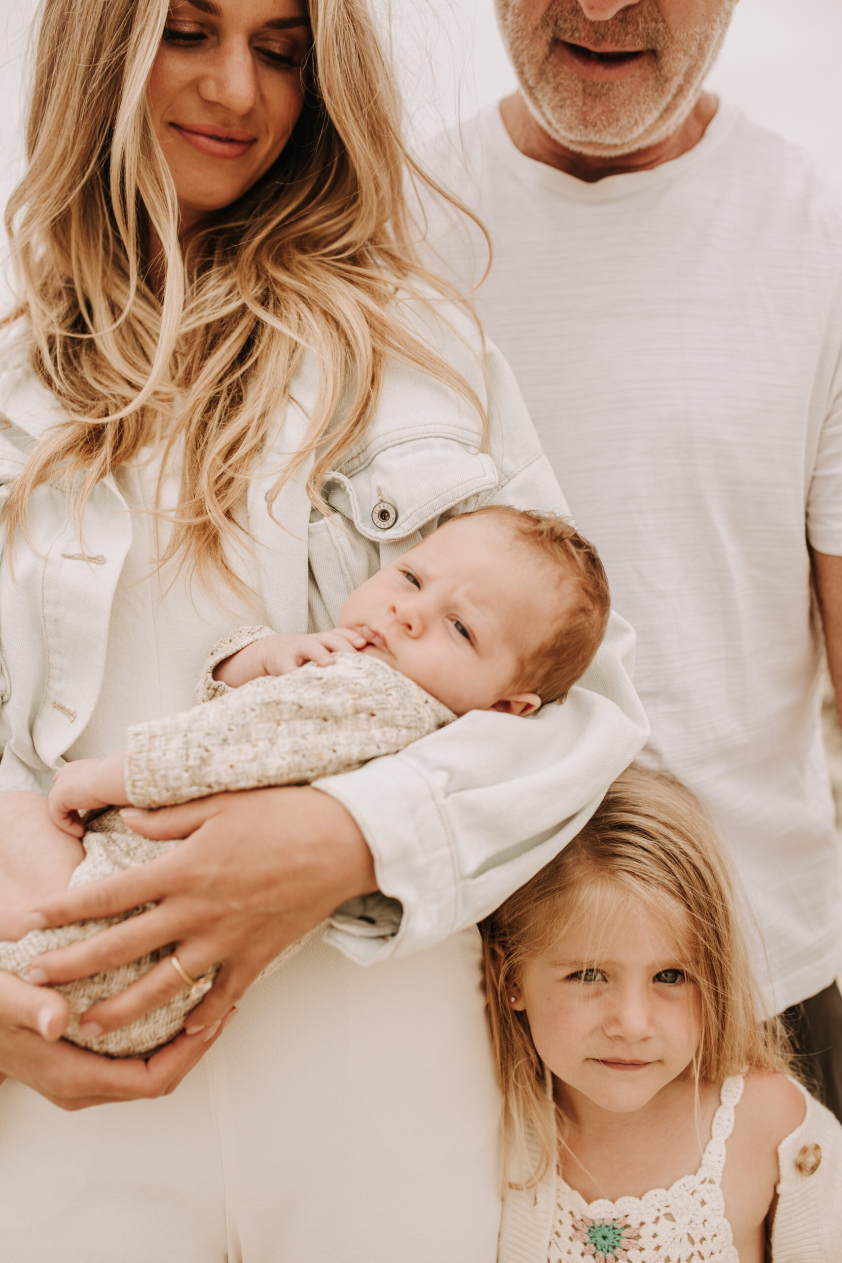 warm toned neutral color outdoor family photos beach day family photos newborn photos infant family cloudy day san digo family photographer Sabrina Kinsella