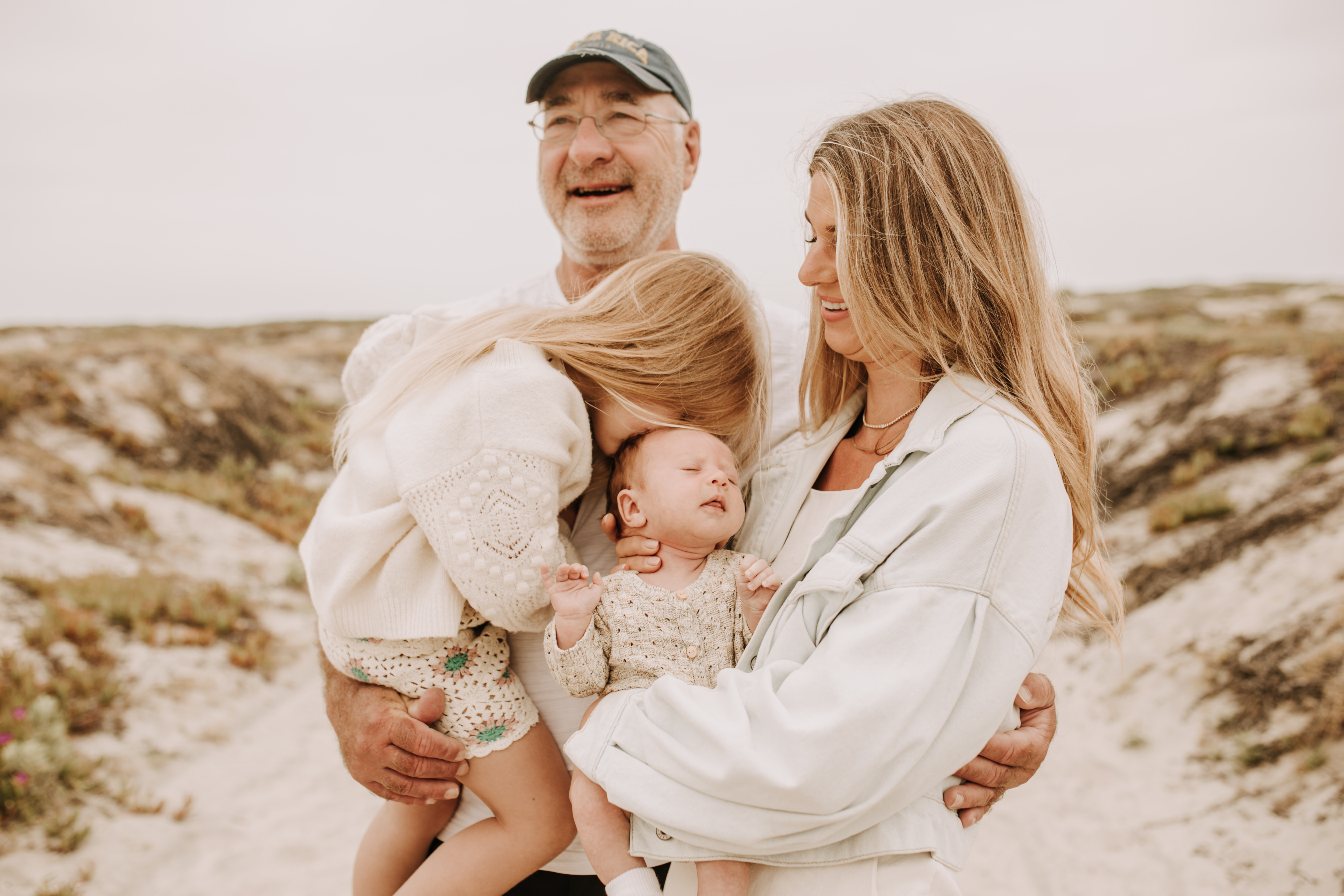 warm toned neutral color outdoor family photos beach day family photos newborn photos infant family cloudy day san digo family photographer Sabrina Kinsella 