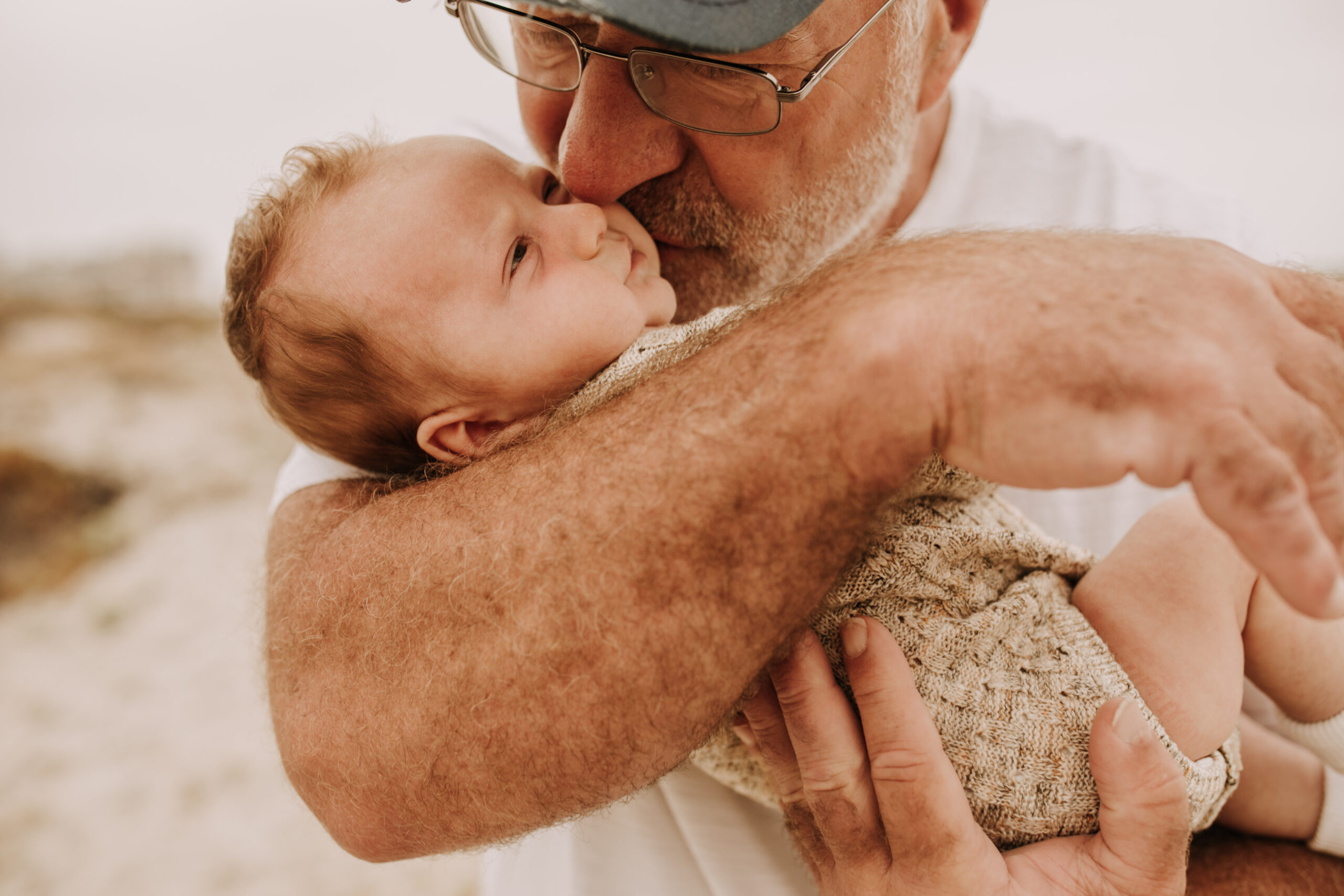 warm toned neutral color outdoor family photos beach day family photos newborn photos infant family cloudy day san digo family photographer Sabrina Kinsella