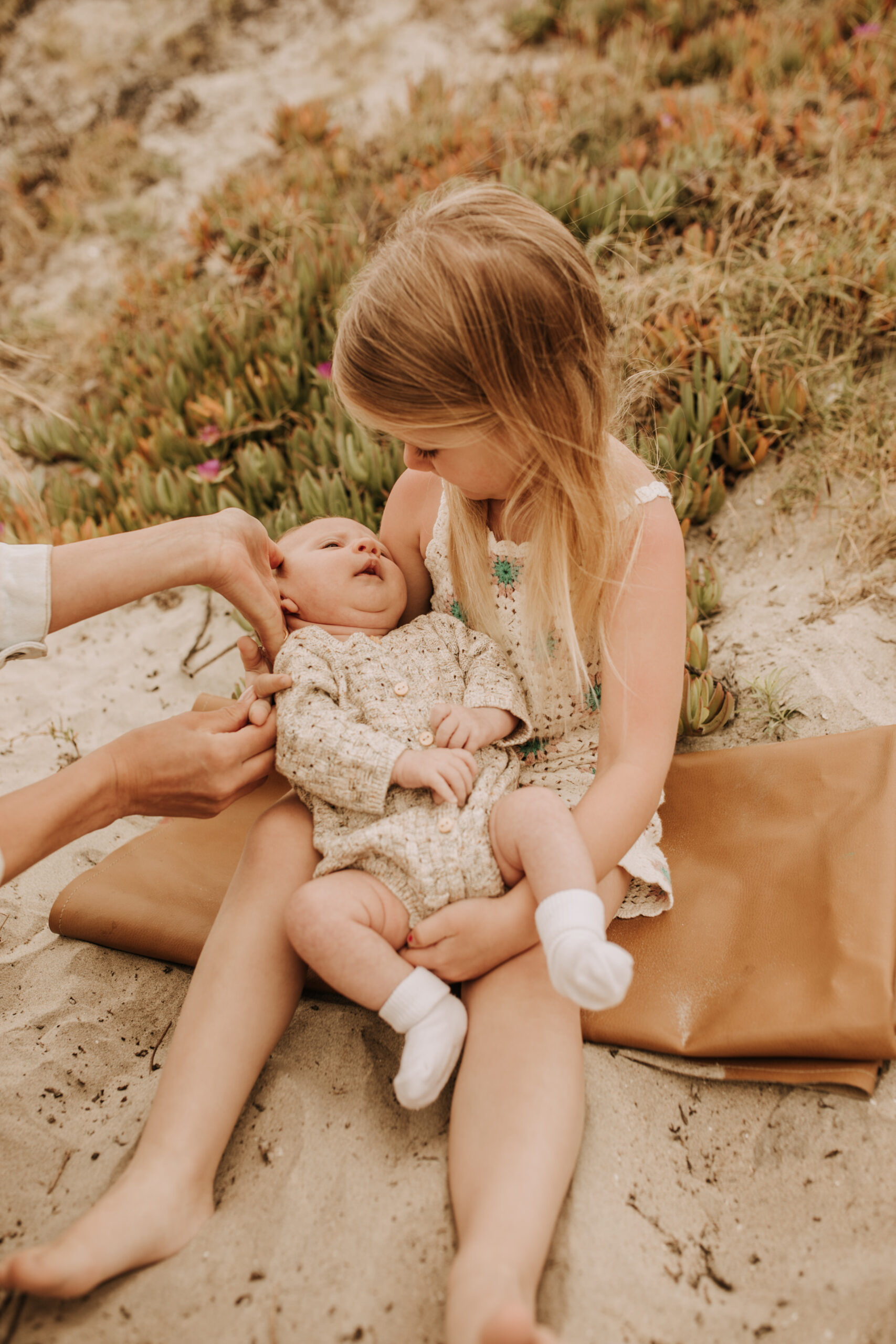 warm toned neutral color outdoor family photos beach day family photos newborn photos infant family cloudy day san digo family photographer Sabrina Kinsella