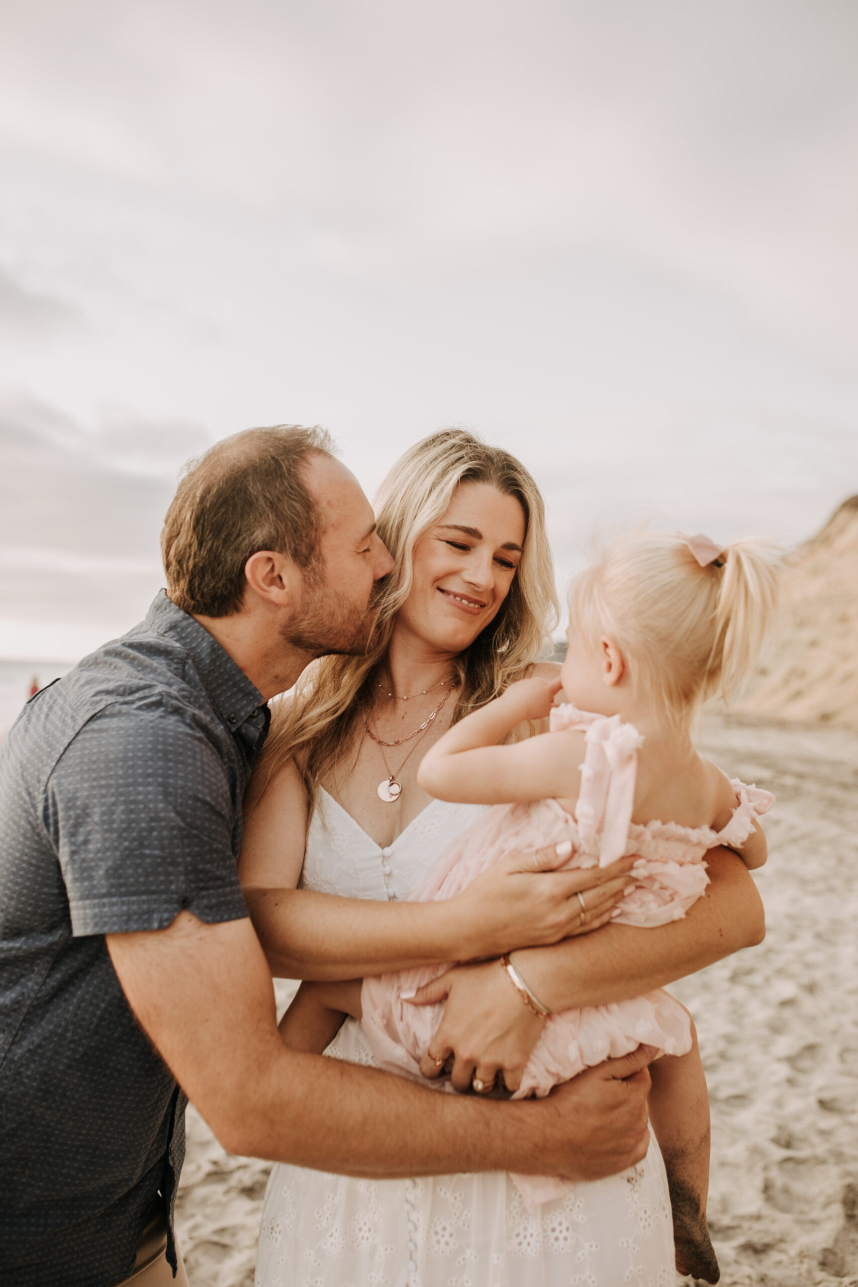 family photos on the beach sunset beach family dad mom baby water golden hour San Diego beach family photos San Diego family photographer