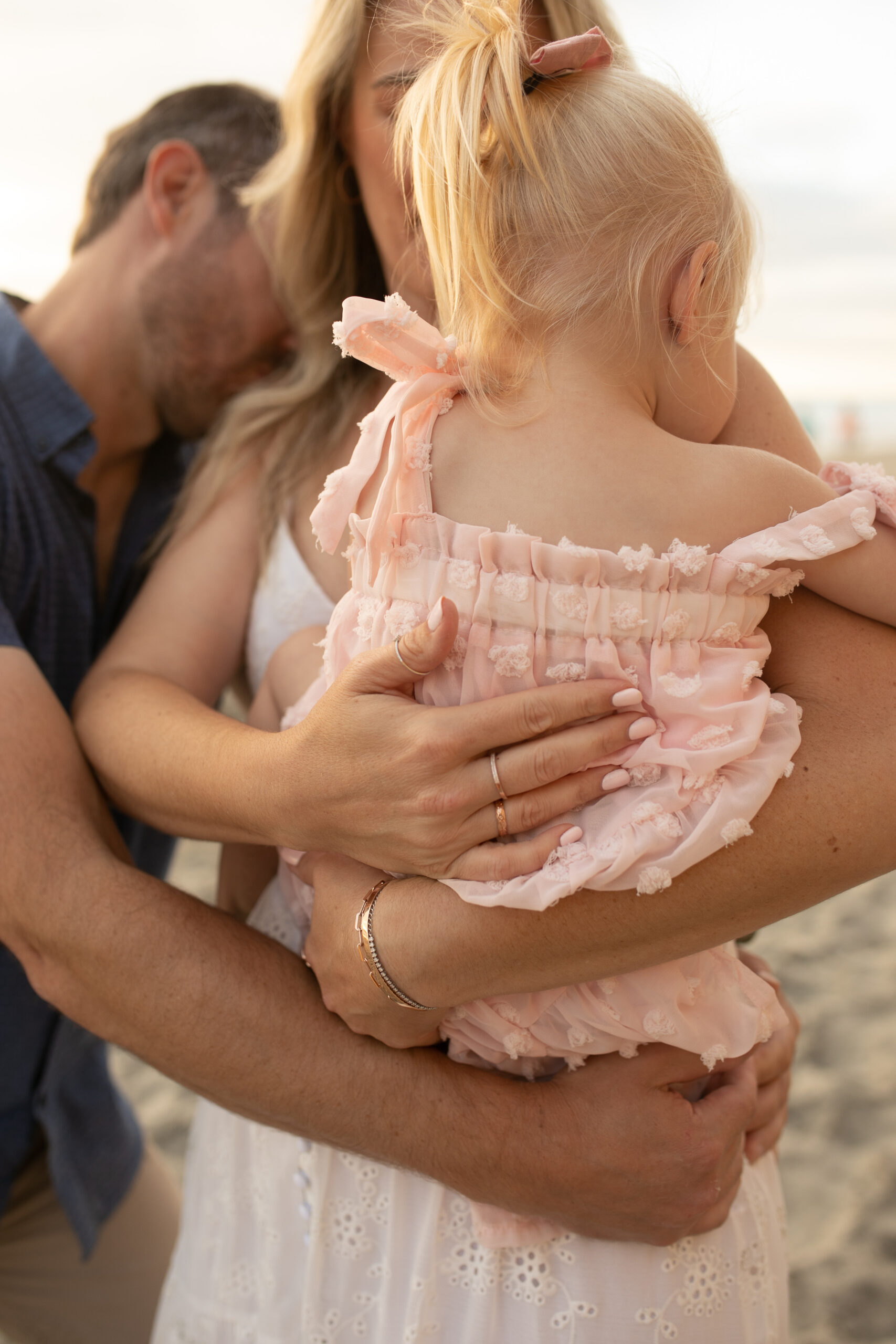 family photos on the beach sunset beach family dad mom baby water golden hour San Diego beach family photos San Diego family photographer