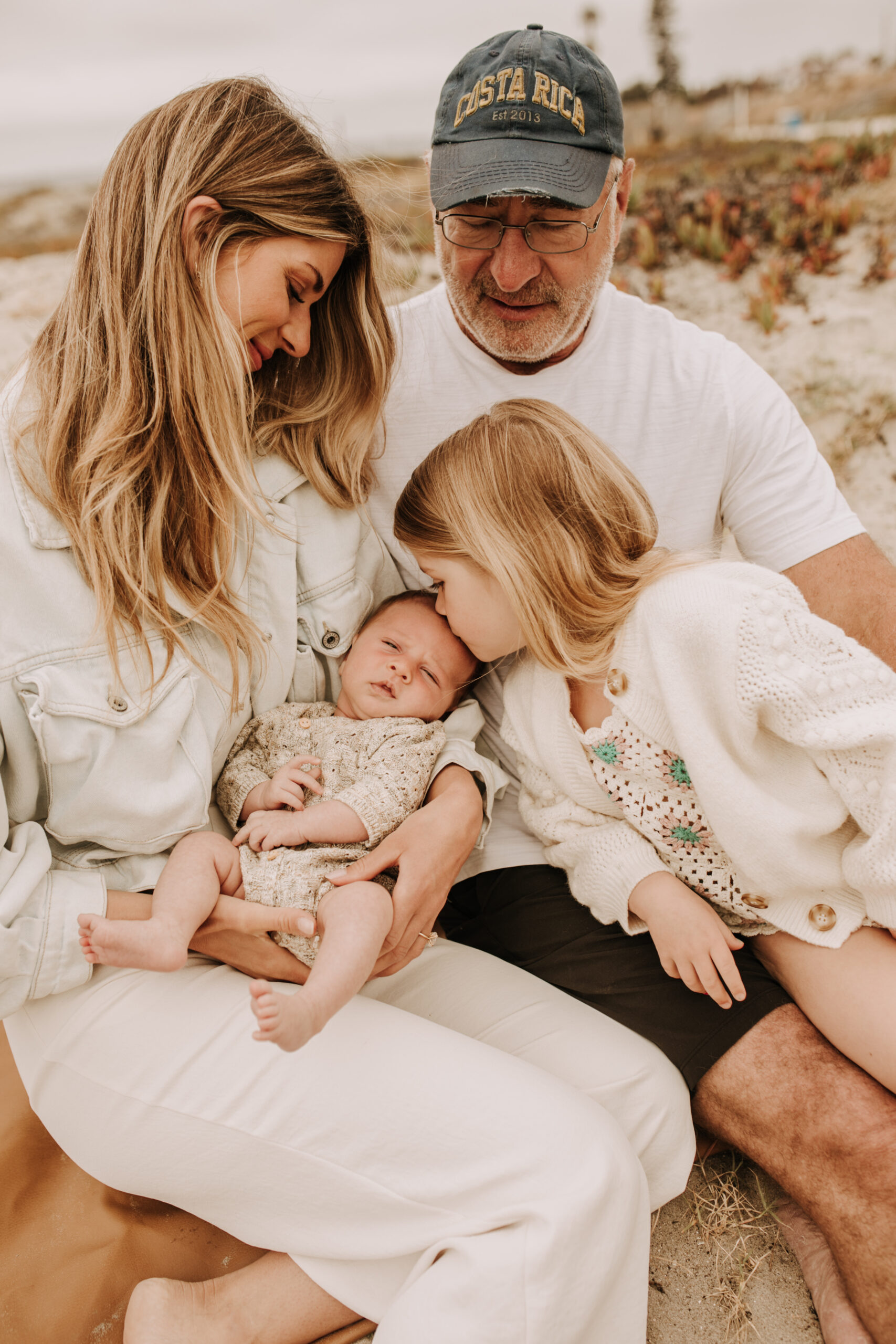 warm toned neutral color outdoor family photos beach day family photos newborn photos infant family cloudy day san digo family photographer Sabrina Kinsella