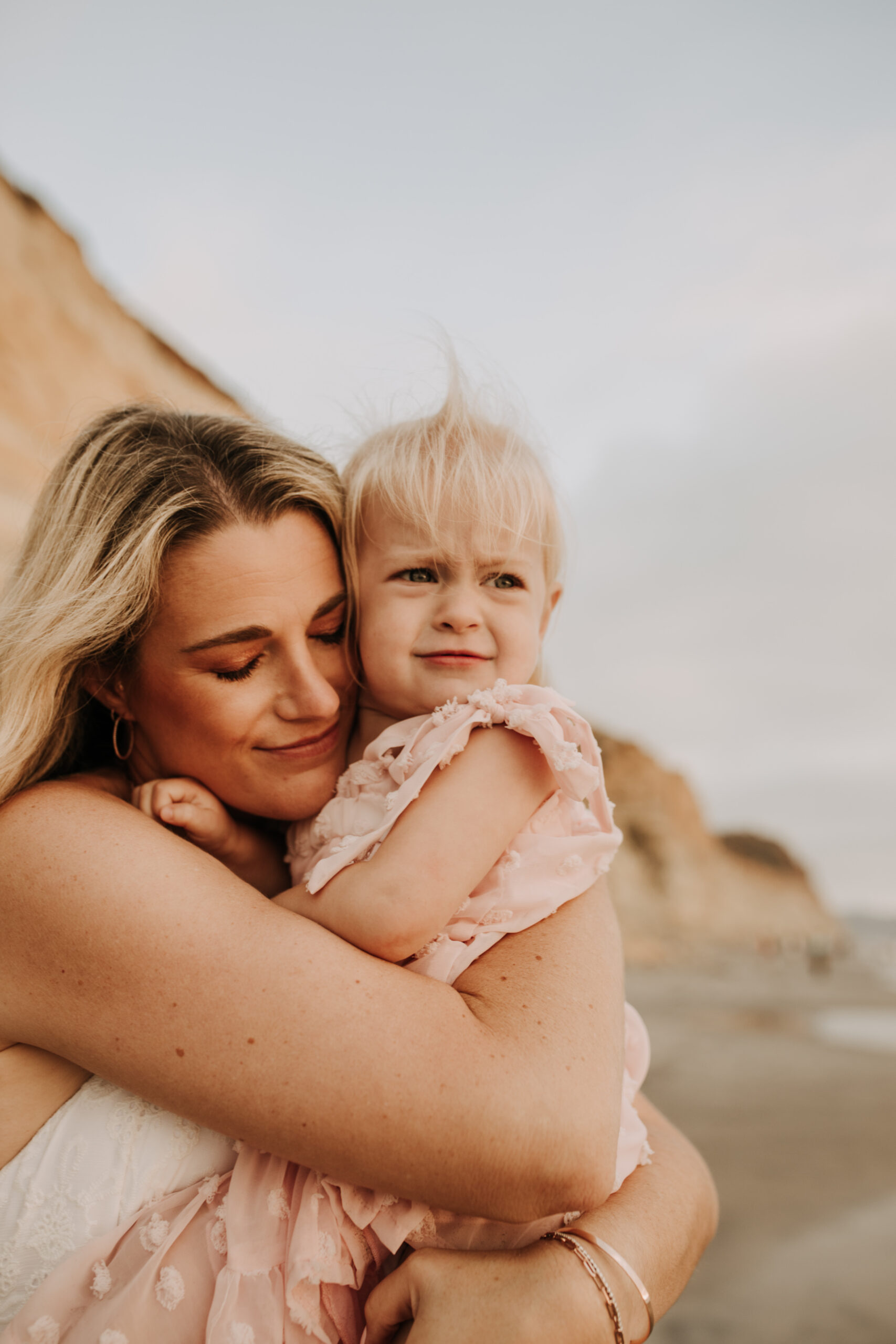 family photos on the beach sunset beach family dad mom baby water golden hour San Diego beach family photos San Diego family photographer