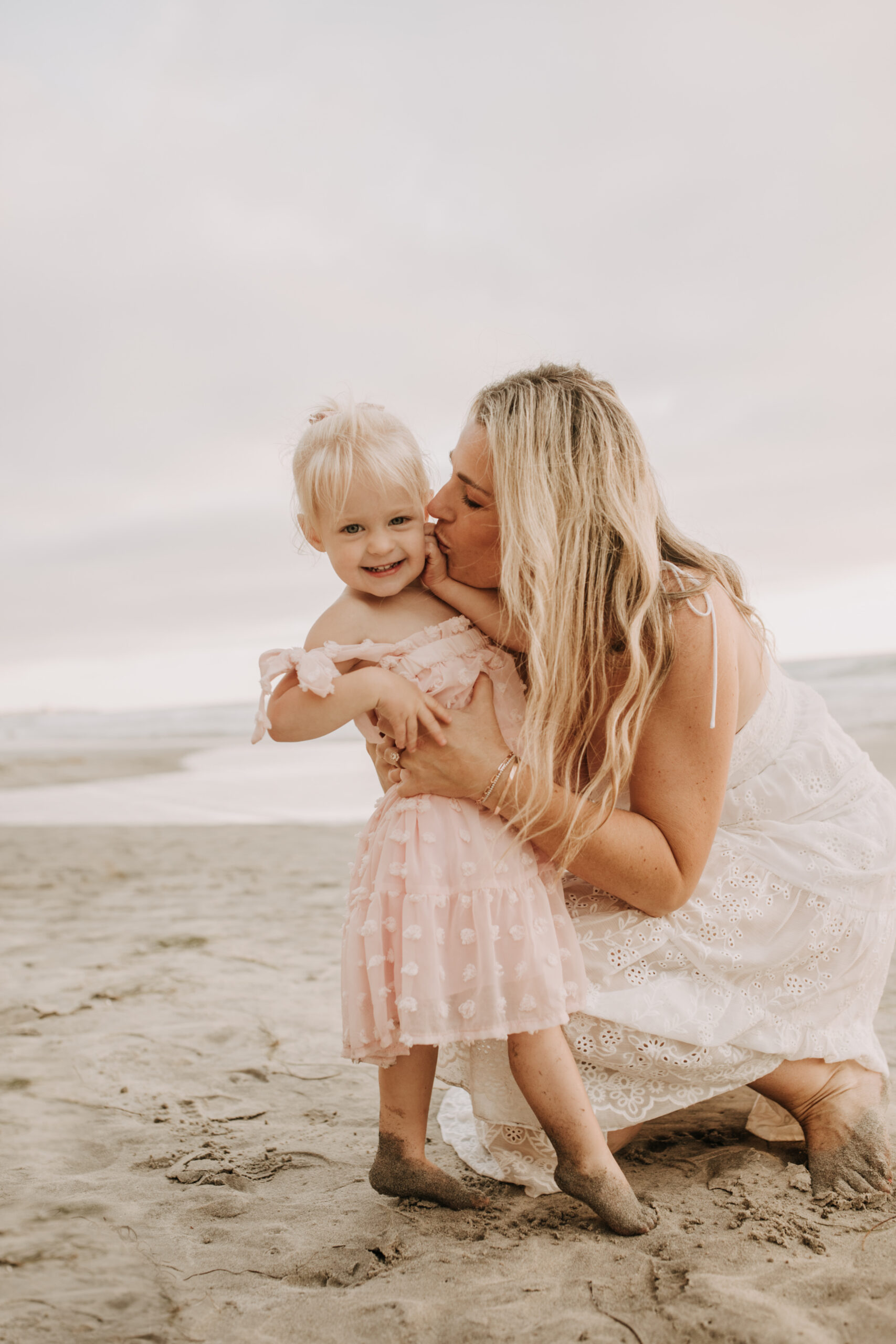 family photos on the beach sunset beach family dad mom baby water golden hour San Diego beach family photos San Diego family photographer