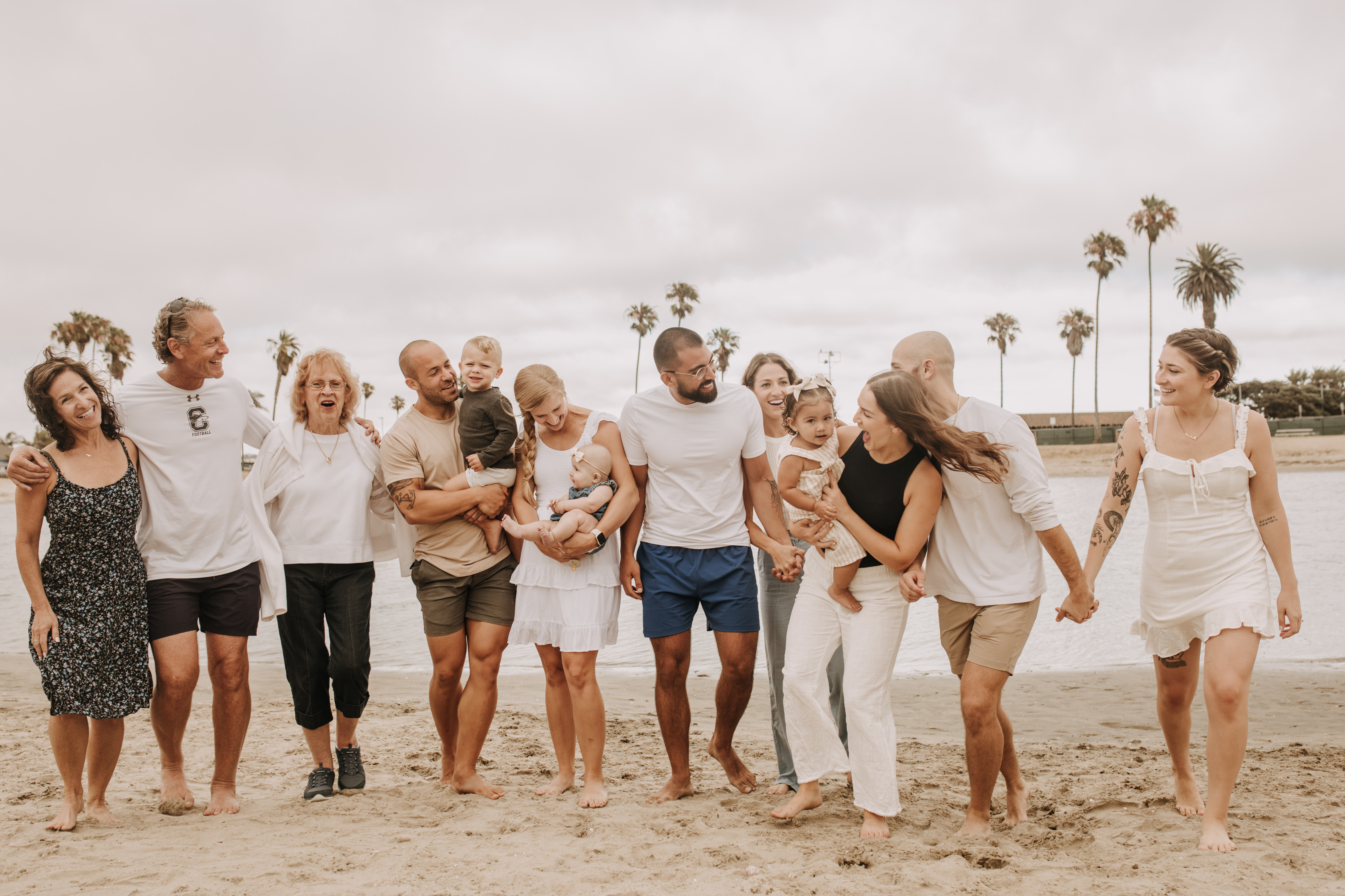 large family beach session family photos on the beach cloudy day big family great grand children San Diego family photographer