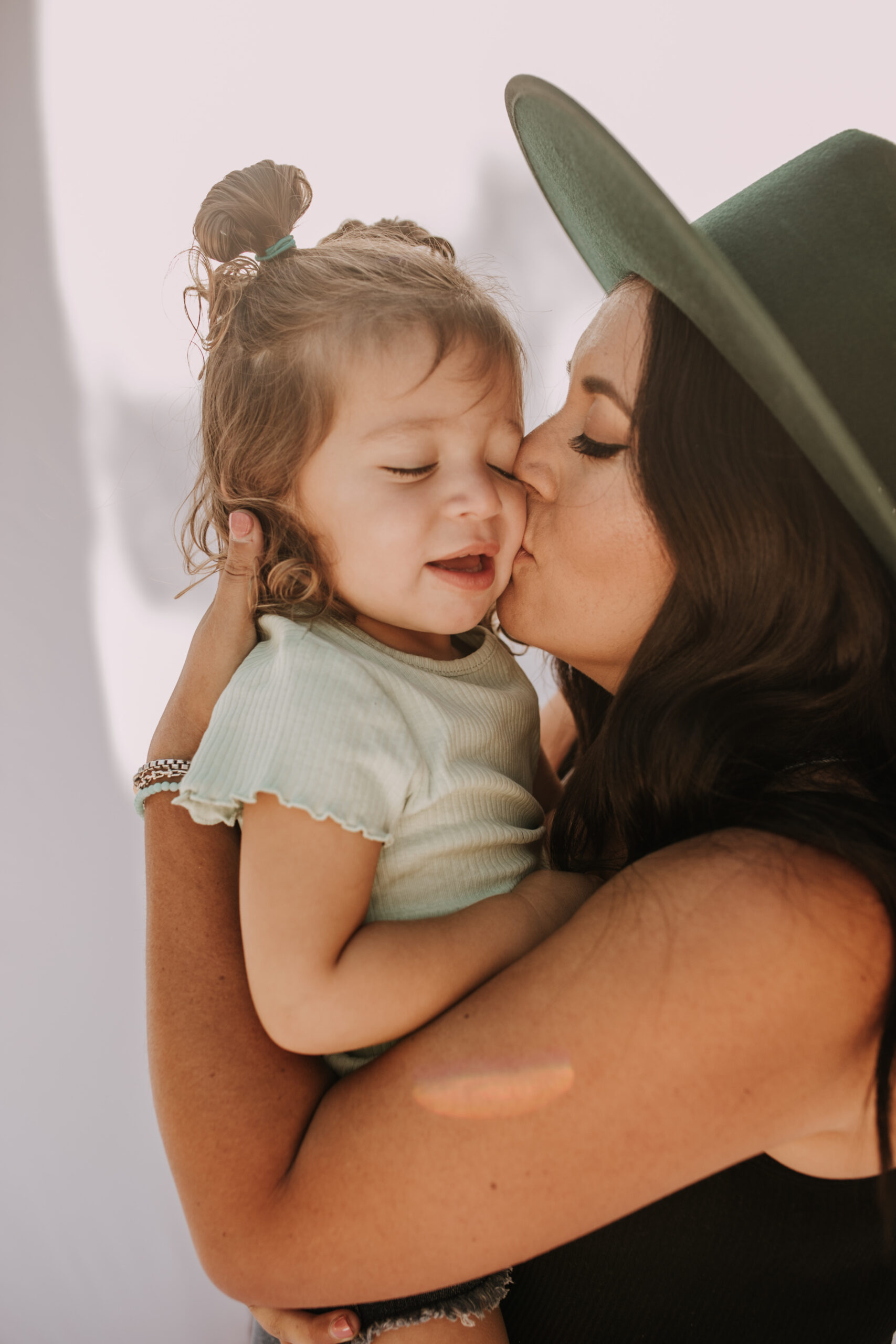 backyard mini session family photos white backdrop outdoor motherhood maternity san diego family photographer