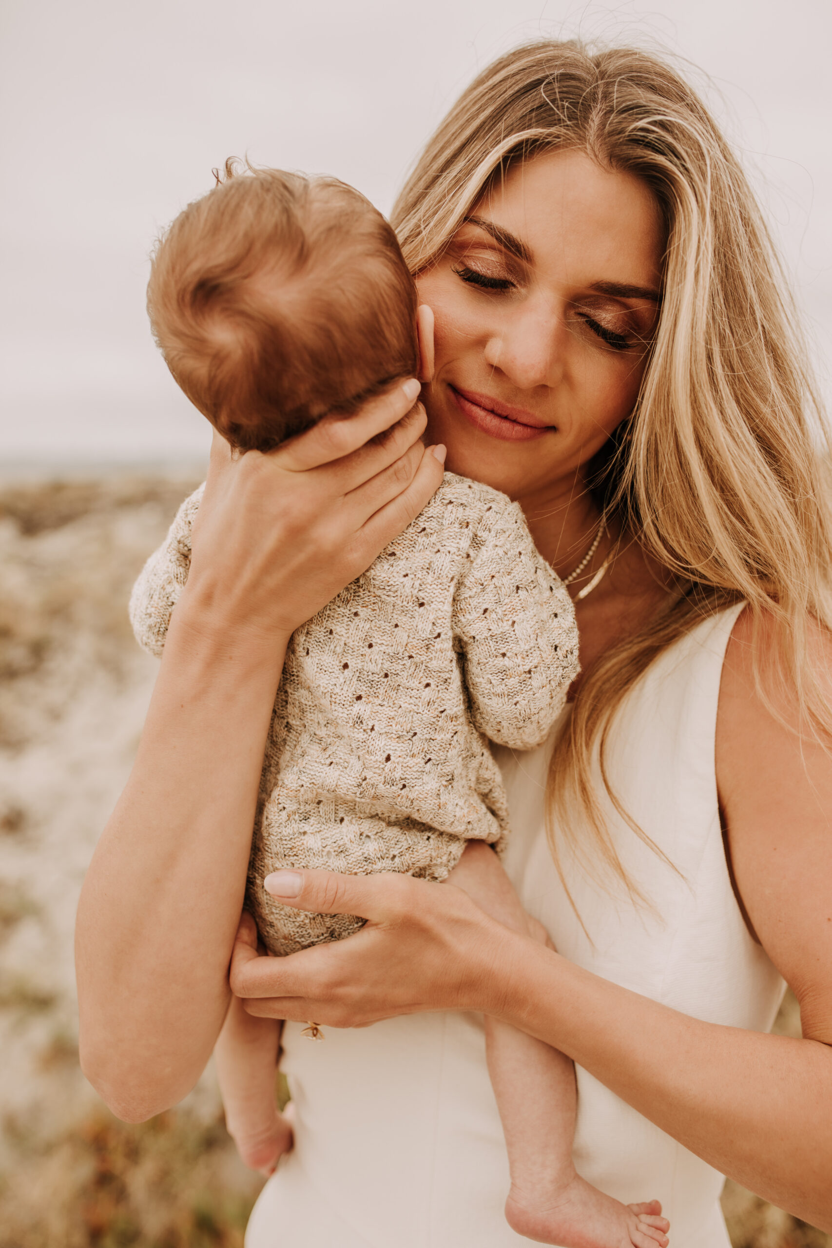 warm toned neutral color outdoor family photos beach day family photos newborn photos infant family cloudy day san digo family photographer Sabrina Kinsella