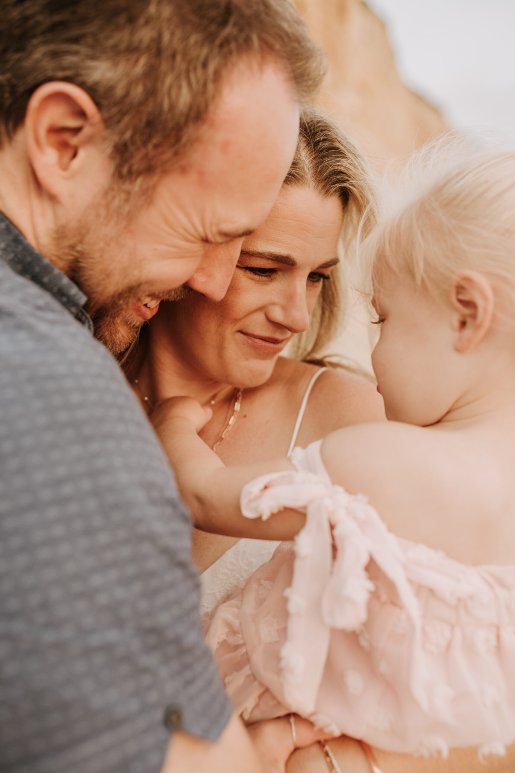 family photos on the beach sunset beach family dad mom baby water golden hour San Diego beach family photos San Diego family photographer