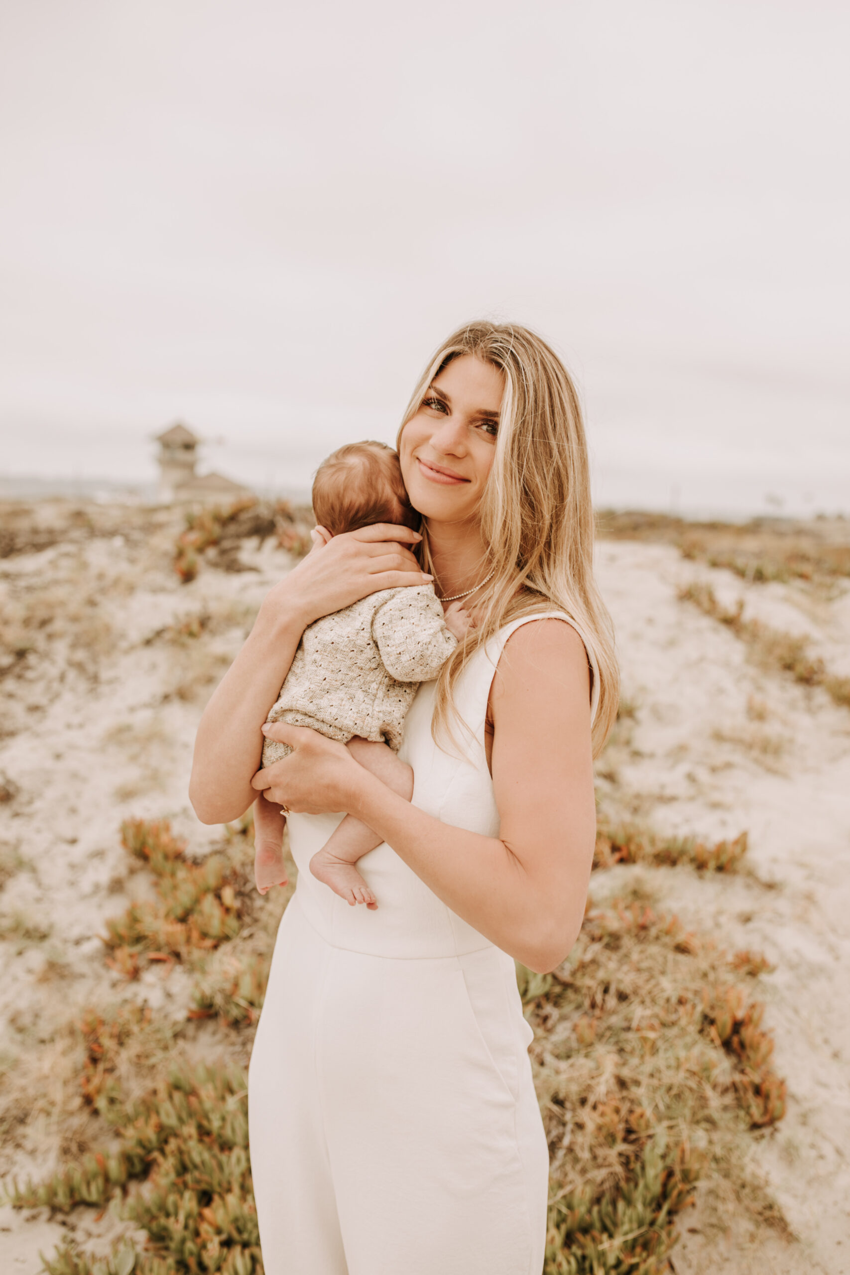 warm toned neutral color outdoor family photos beach day family photos newborn photos infant family cloudy day san digo family photographer Sabrina Kinsella