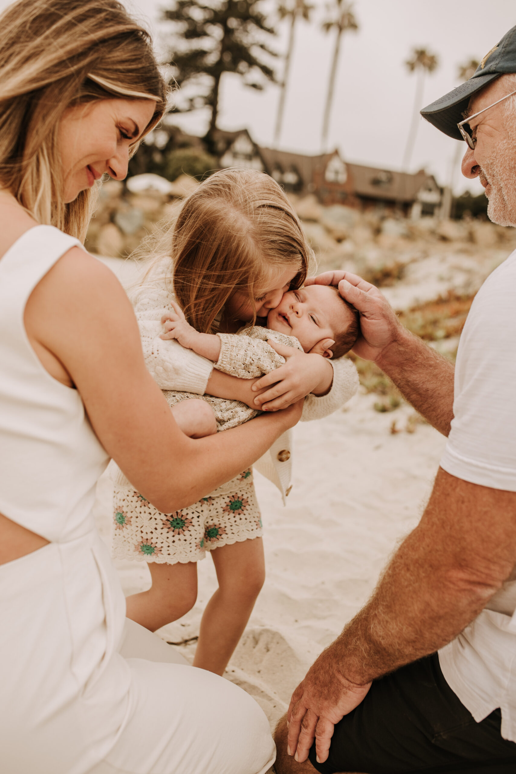 warm toned neutral color outdoor family photos beach day family photos newborn photos infant family cloudy day san digo family photographer Sabrina Kinsella