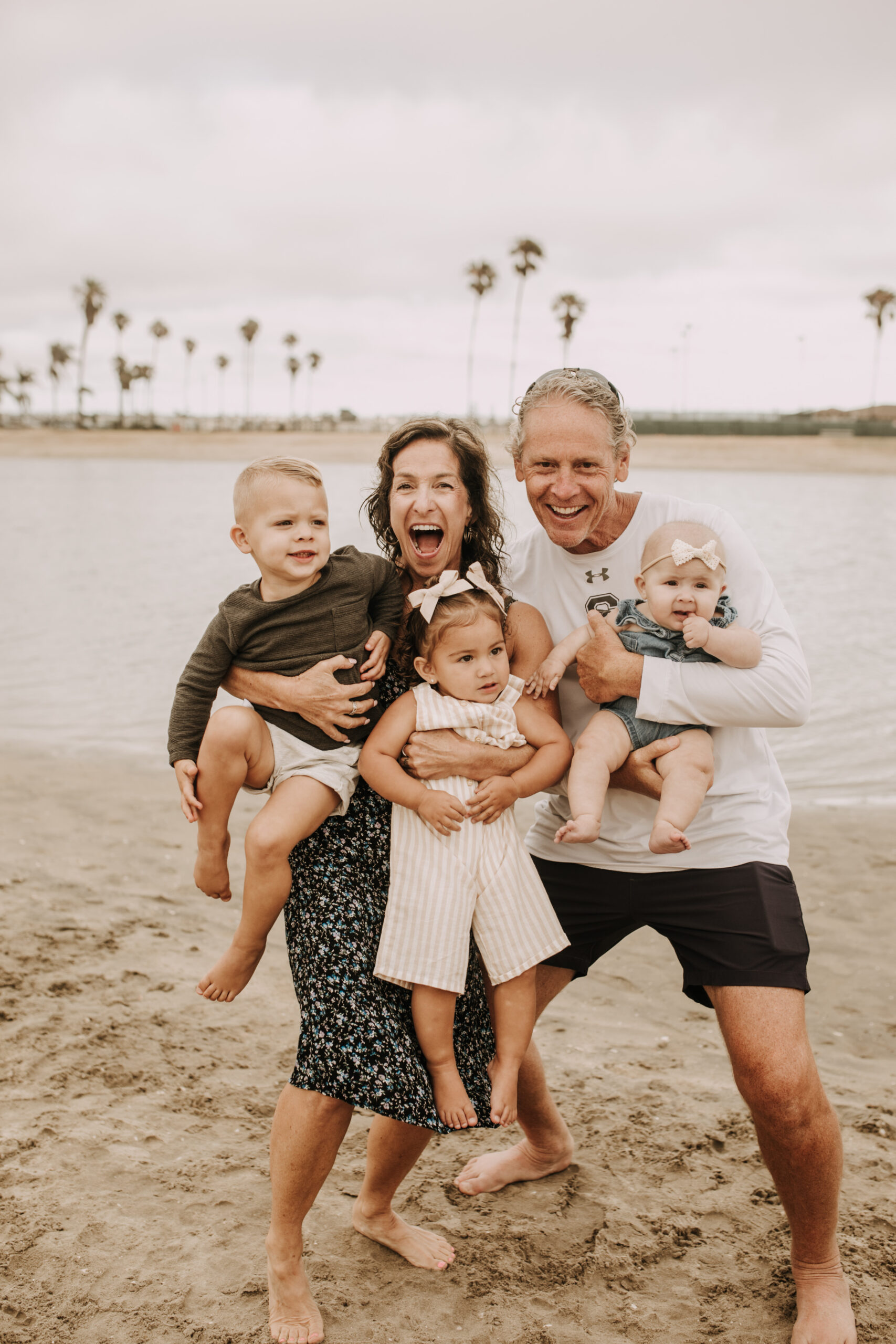 large family beach session family photos on the beach cloudy day big family great grand children San Diego family photographer