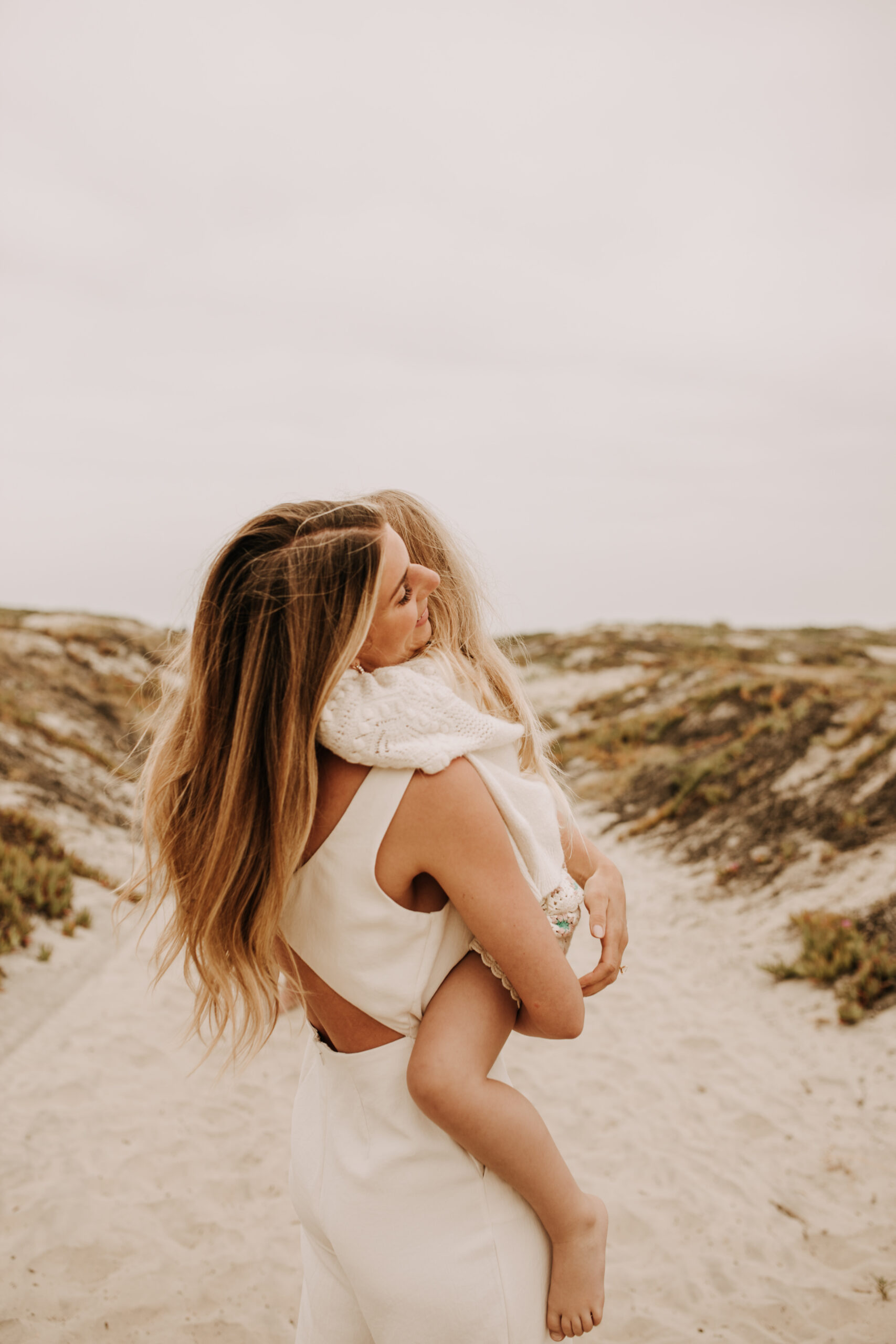 warm toned neutral color outdoor family photos beach day family photos newborn photos infant family cloudy day san digo family photographer Sabrina Kinsella