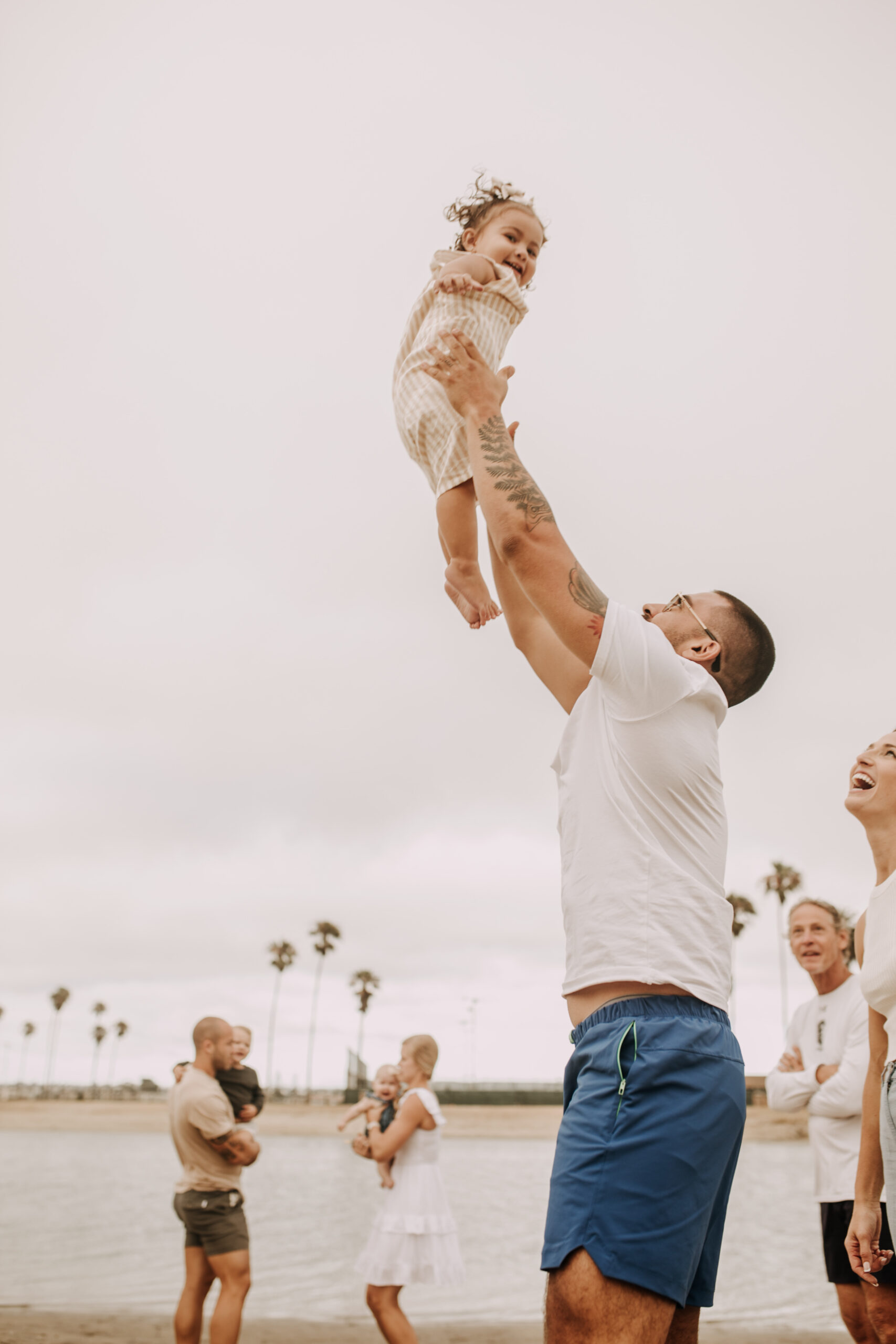 large family beach session family photos on the beach cloudy day big family great grand children San Diego family photographer