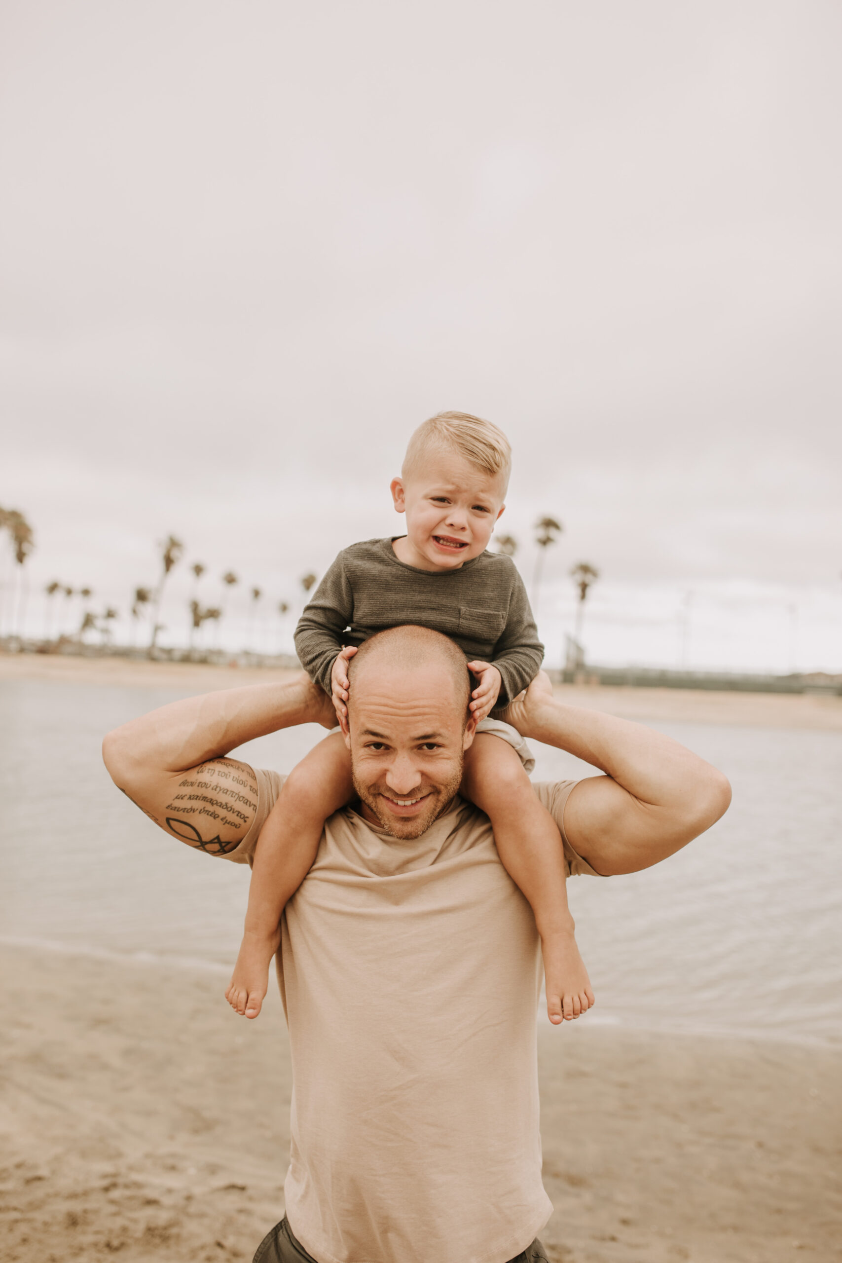 large family beach session family photos on the beach cloudy day big family great grand children San Diego family photographer