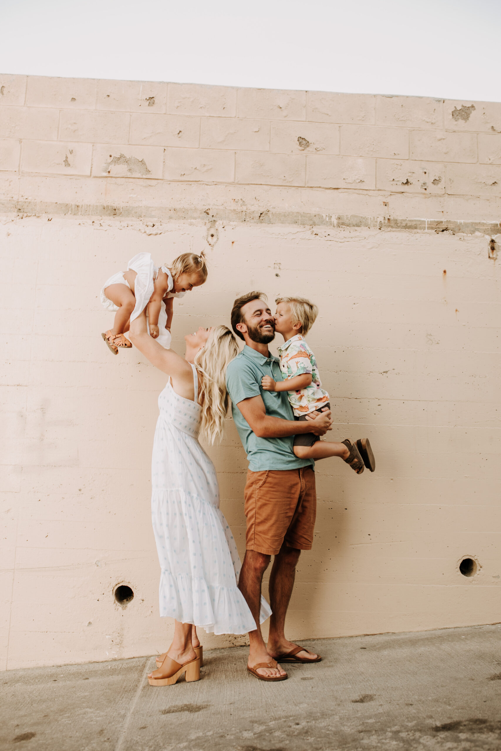 Family photos on the beach cool blue toned family photos San Diego photography family of four candid family moments family love beach family photos San Diego family photographer Sabrinalynnphoto