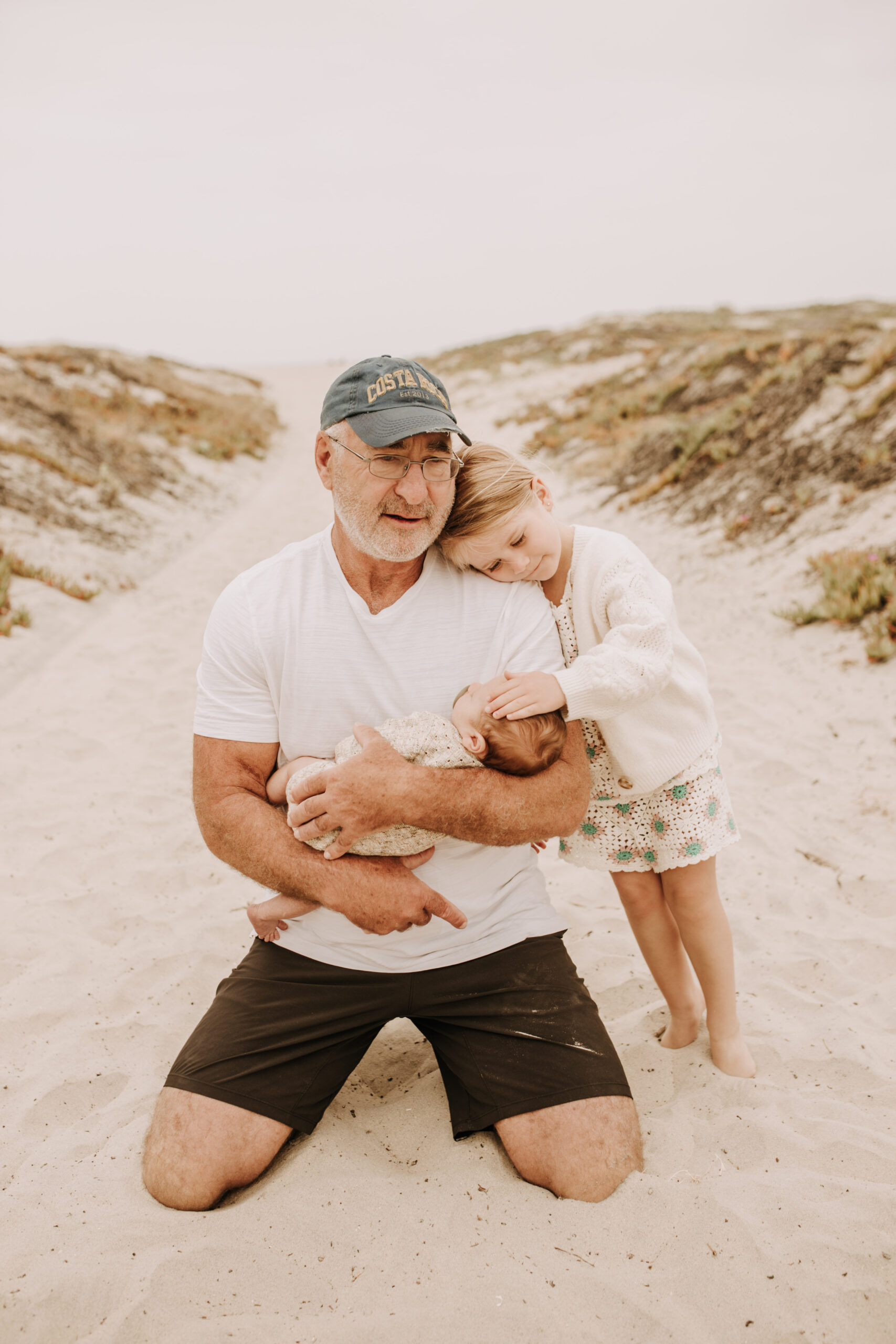 warm toned neutral color outdoor family photos beach day family photos newborn photos infant family cloudy day san digo family photographer Sabrina Kinsella