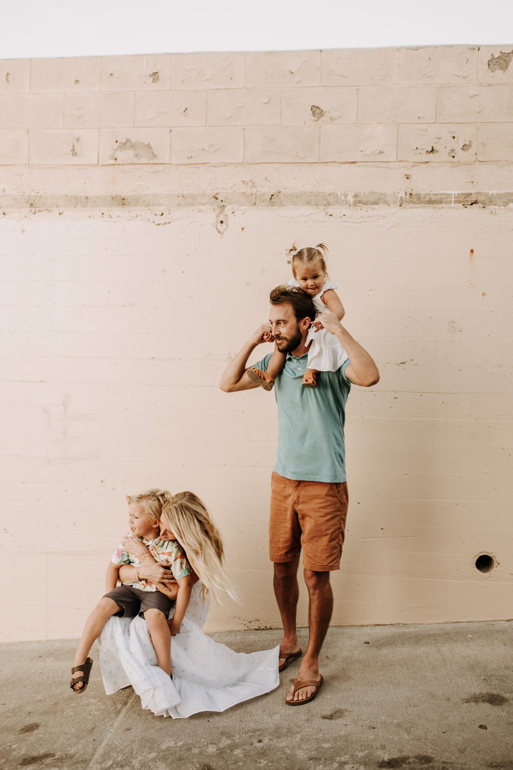 Family photos on the beach cool blue toned family photos San Diego photography family of four candid family moments family love beach family photos San Diego family photographer Sabrinalynnphoto