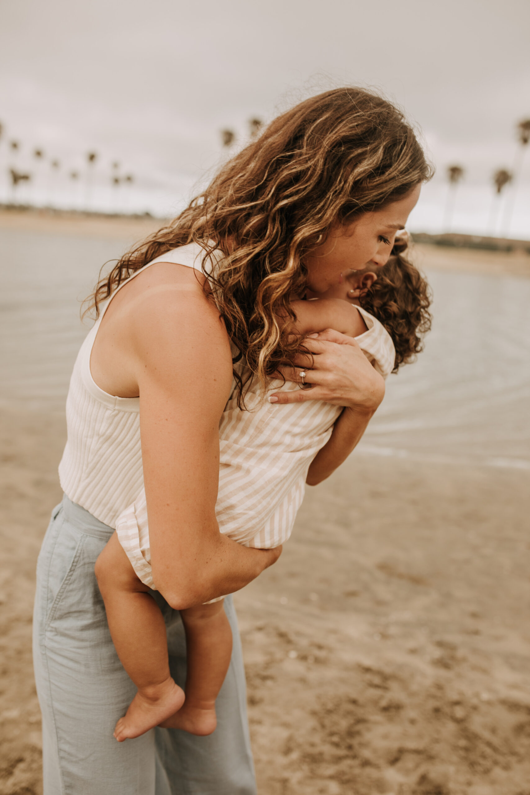 large family beach session family photos on the beach cloudy day big family great grand children San Diego family photographer